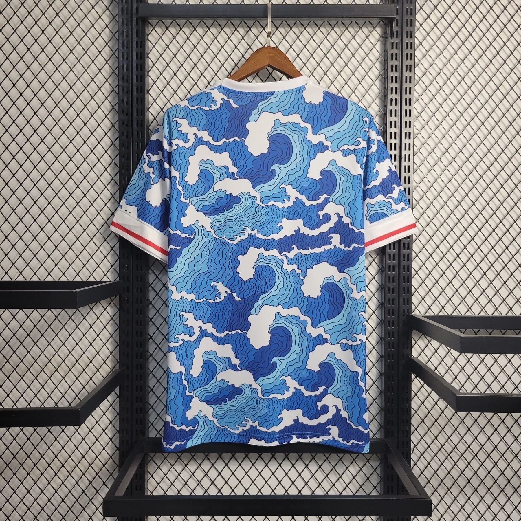 Leazofoot Japan 22/23 concept soccer jersey featuring a blue and white Japanese wave pattern on a hanger