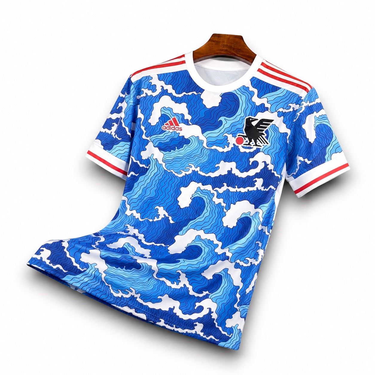 Leazofoot Japan 22/23 concept soccer jersey featuring a blue and white wave pattern with red and white sleeve trim.
