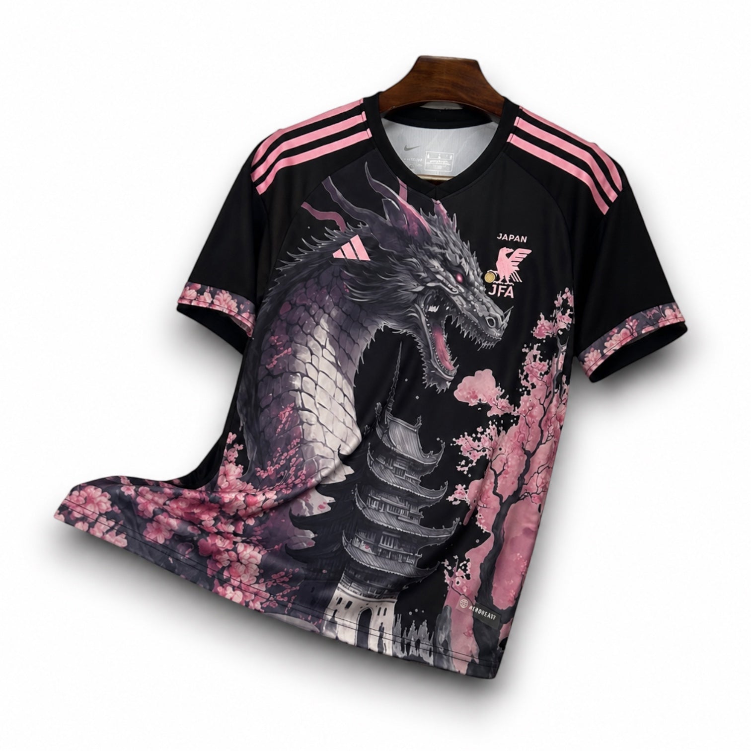 Leazofoot Japan concept soccer jersey featuring a black dragon and pink cherry blossom design on a black background.