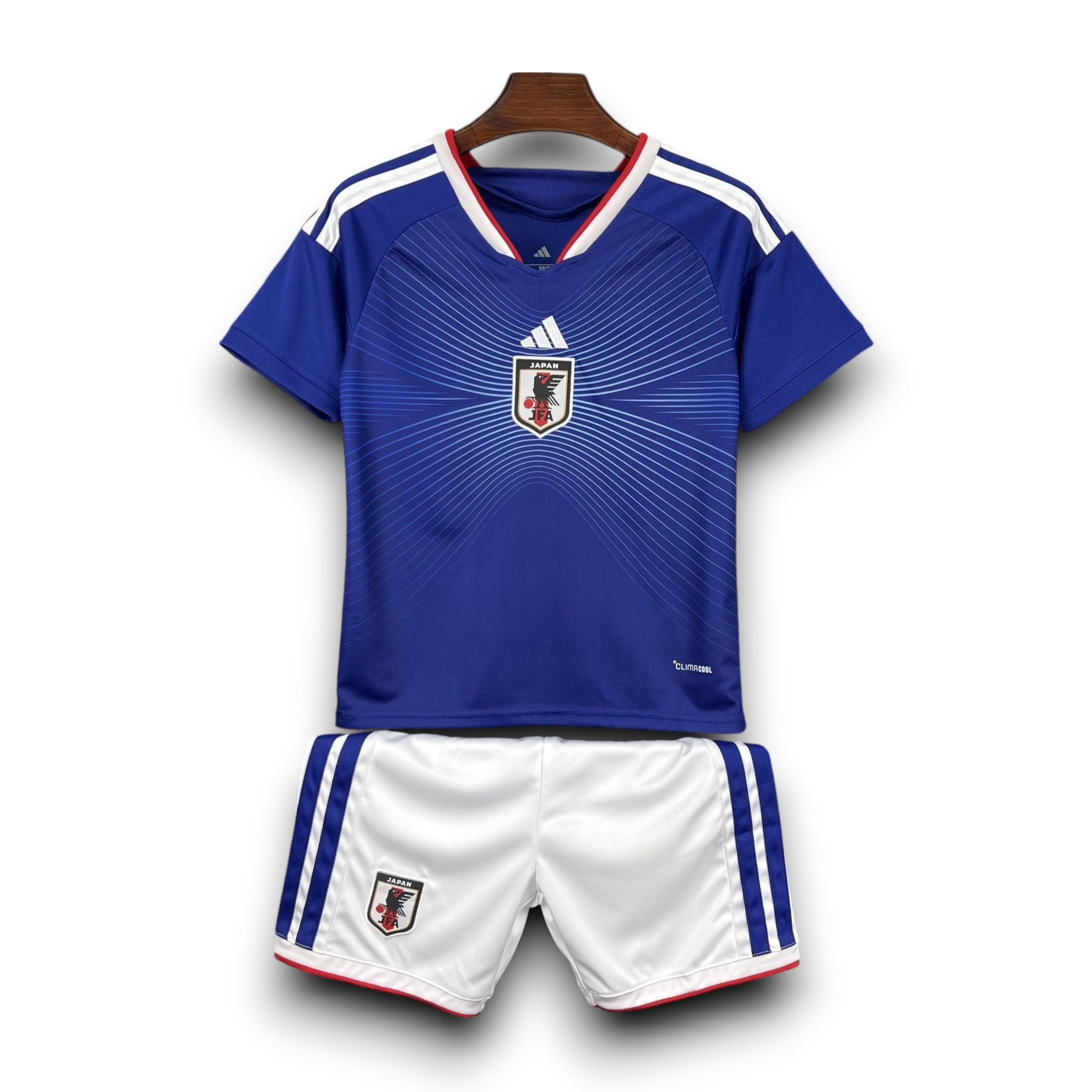 Leazofoot Japan kids' soccer uniform, blue jersey with white trim and crest, white shorts with blue trim and crest.