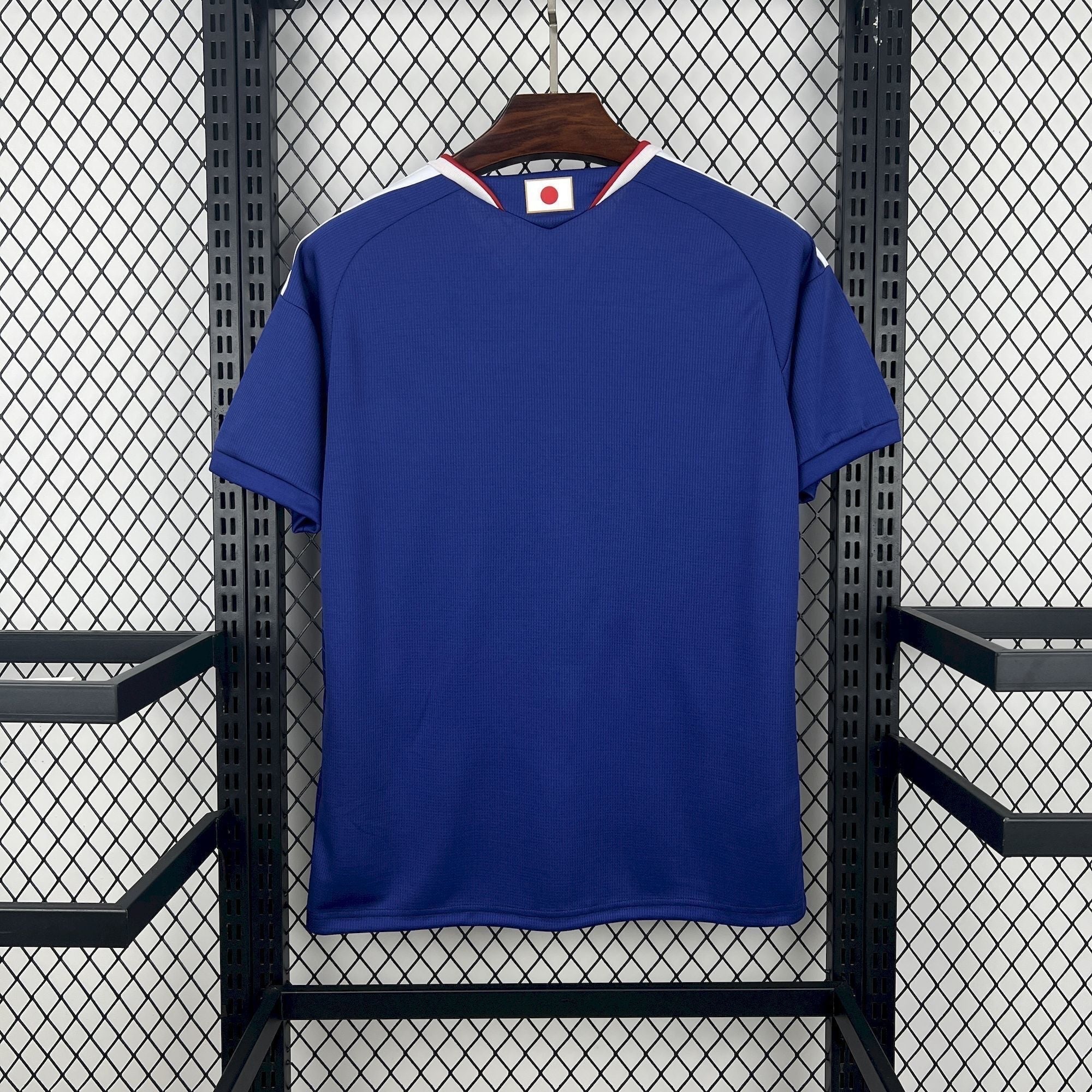 Leazofoot Japan home soccer jersey 2026, royal blue with white and red trim at the collar.