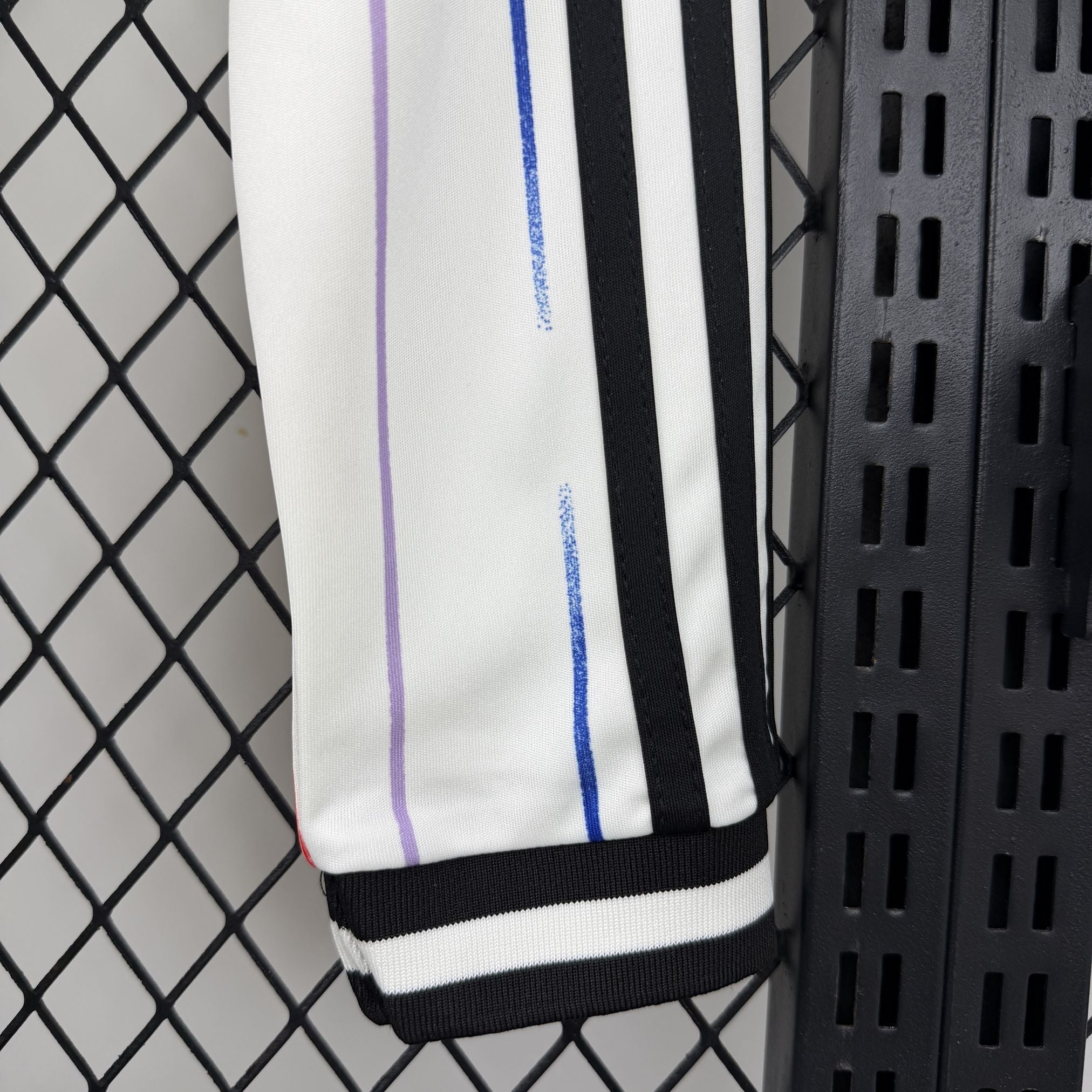 Leazofoot JAPON 2026 long sleeve away jersey with purple and blue vertical stripes and black Adidas stripes.
