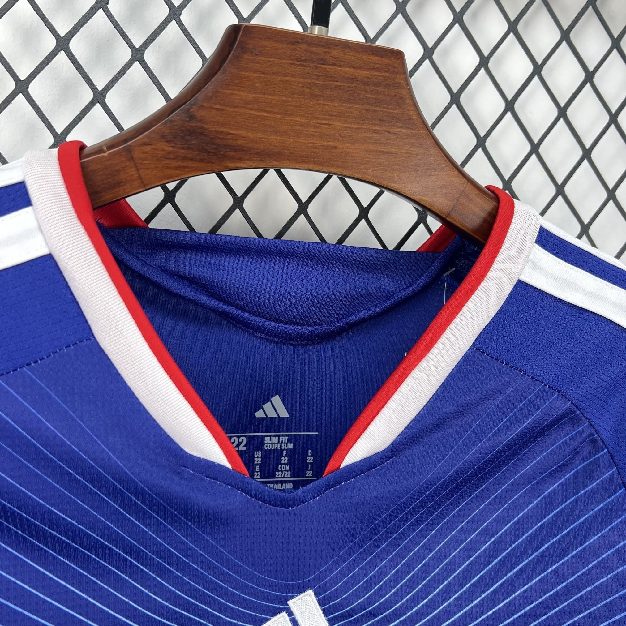 Leazofoot blue and white striped children's football jersey with red trim