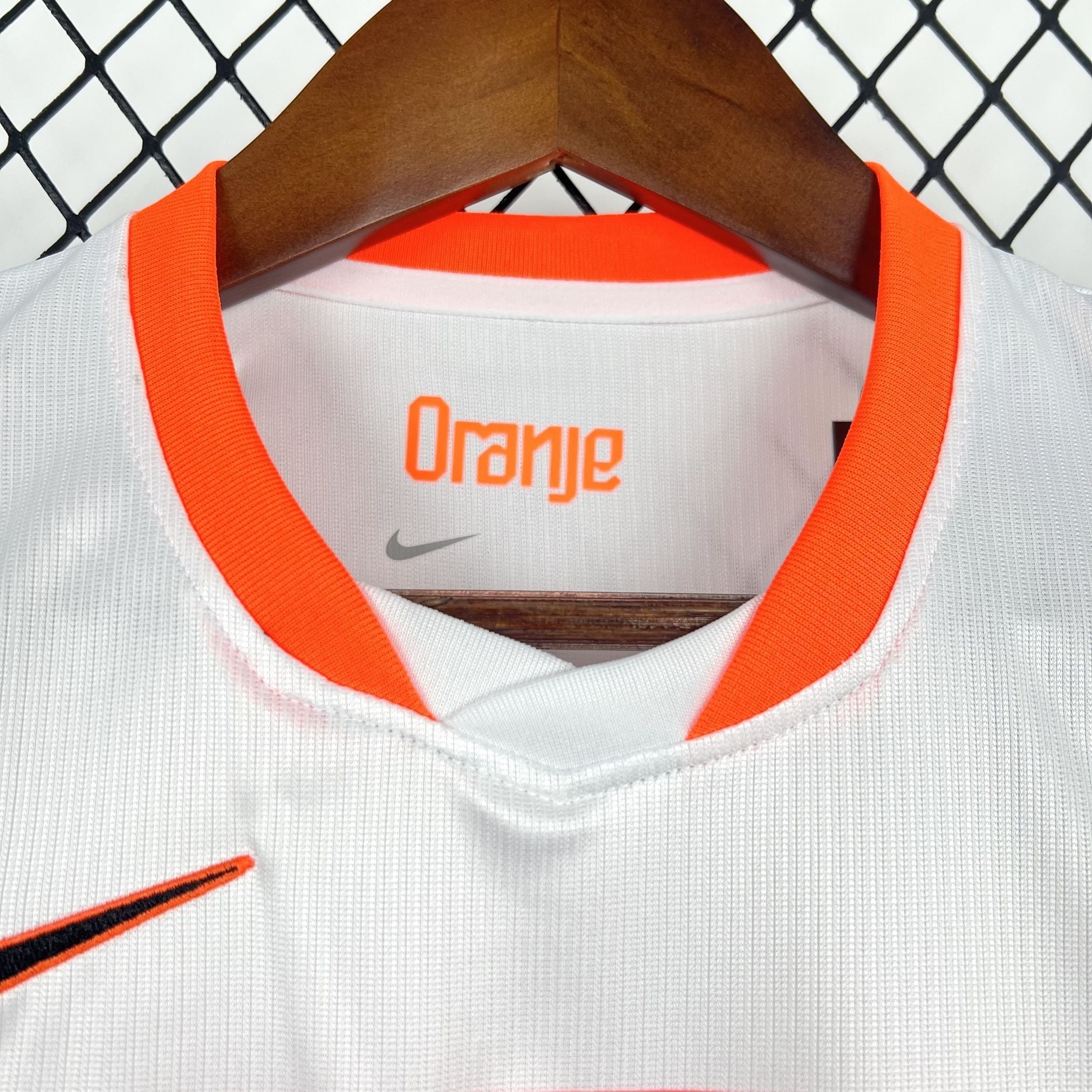 Leazofoot white kids' soccer jersey with orange trim and "Oranje" text on the collar.