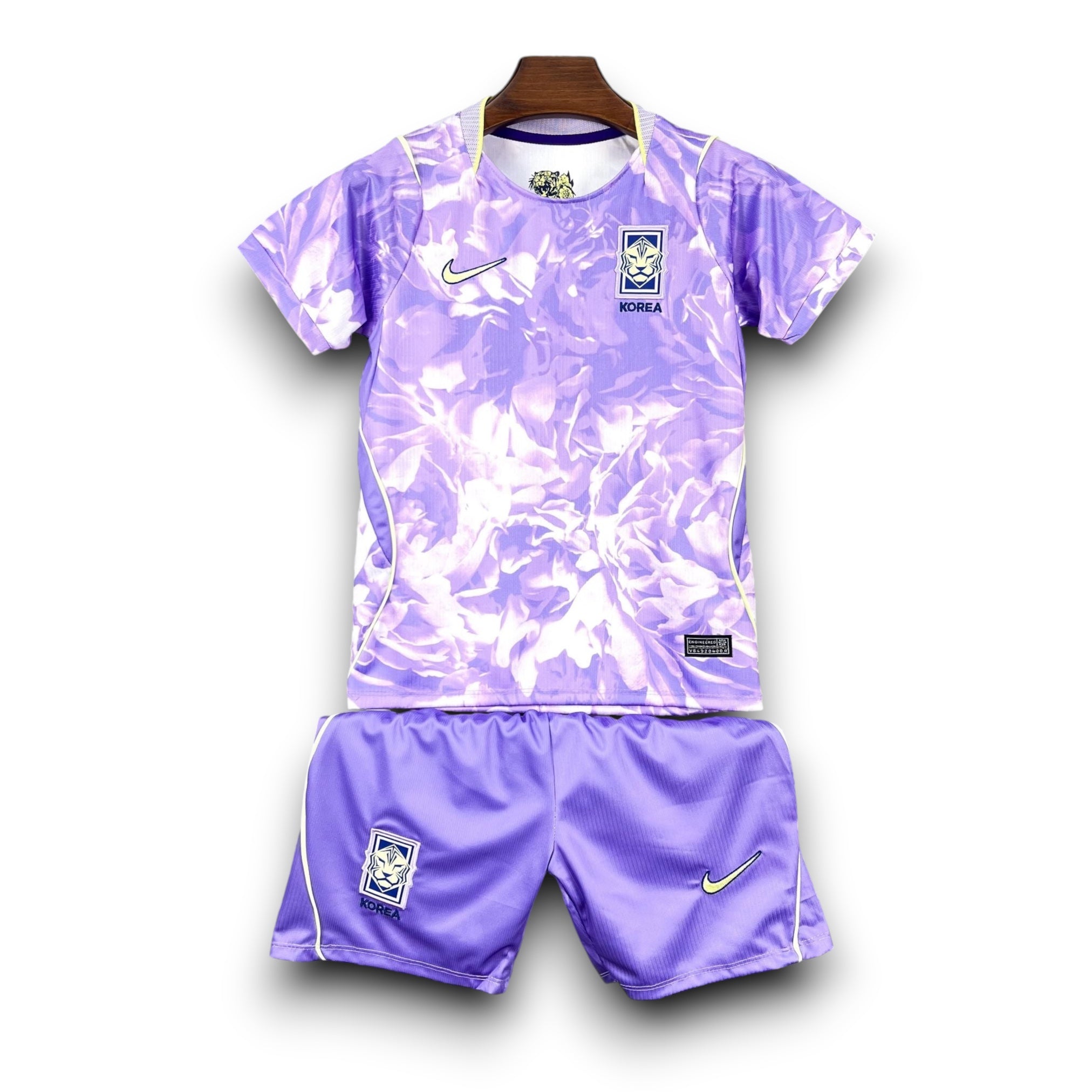 Leazofoot South Korea kids' soccer uniform, purple tie-dye pattern jersey and shorts with Nike logo and team crest.