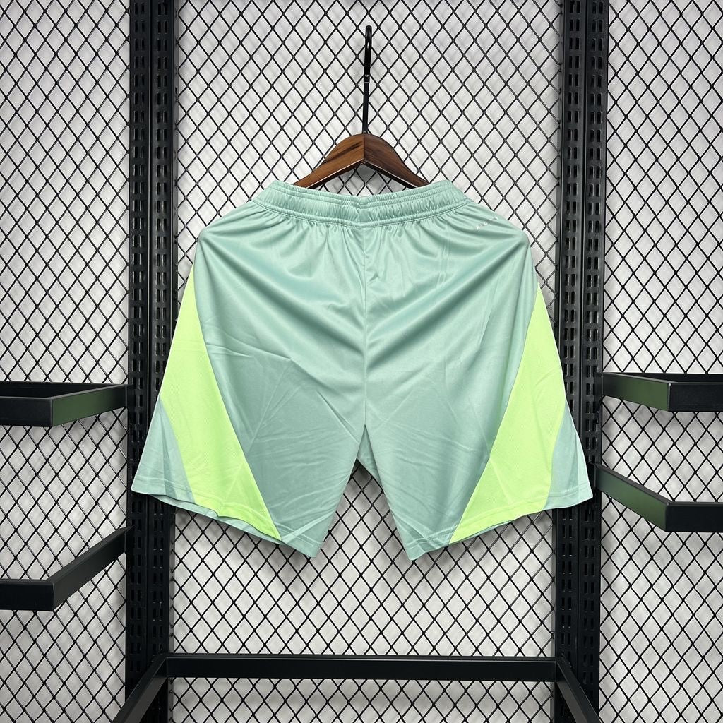 Leazofoot Mexico 2022 concept soccer shorts in light green with neon yellow side panels and an elastic waistband.
