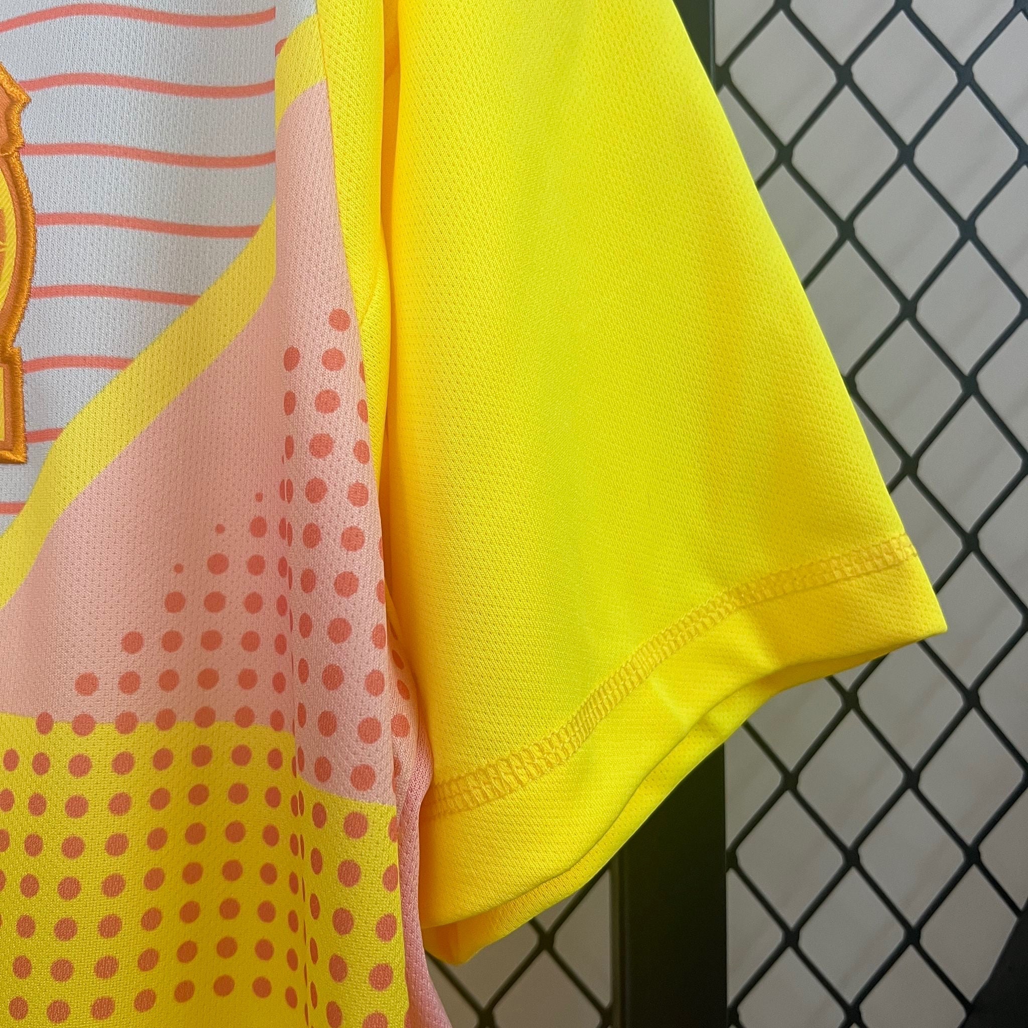 Leazofoot Mexico 2024 goalkeeper jersey in bright yellow with pink polka dot and white striped graphic patterns.
