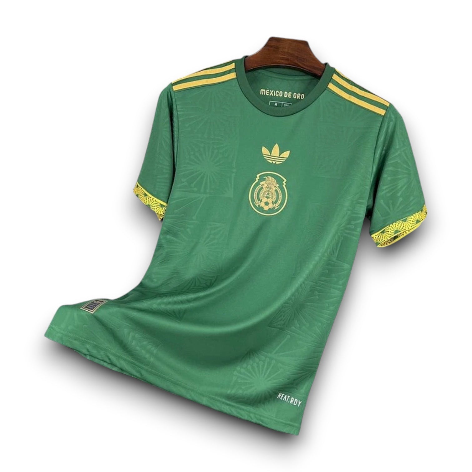 Leazofoot Mexico 2025 home jersey in green with gold accents, featuring a subtle pattern and central team crest.