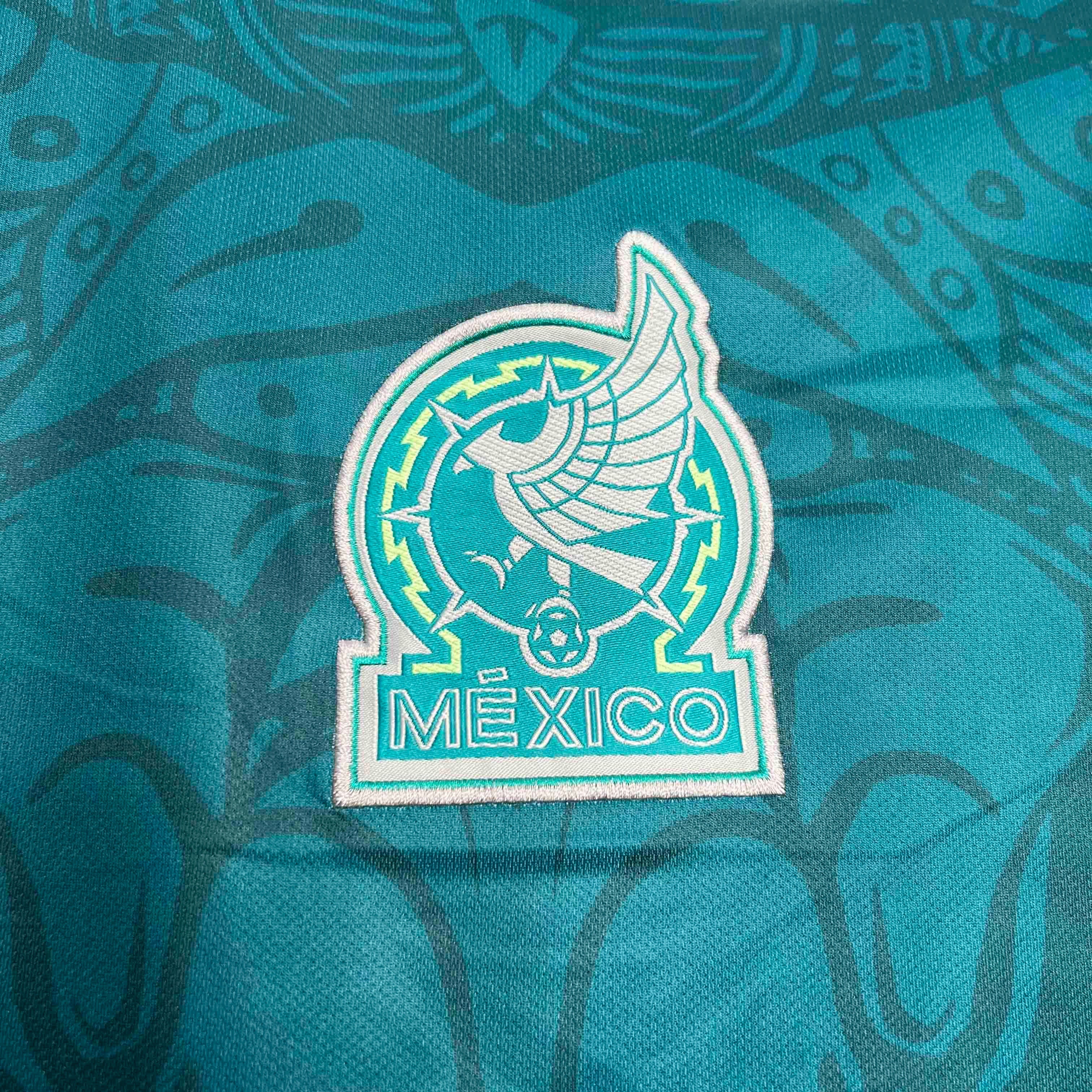 Leazofoot Mexico 24/25 special edition soccer jersey featuring a teal fabric with intricate Aztec-inspired patterns.