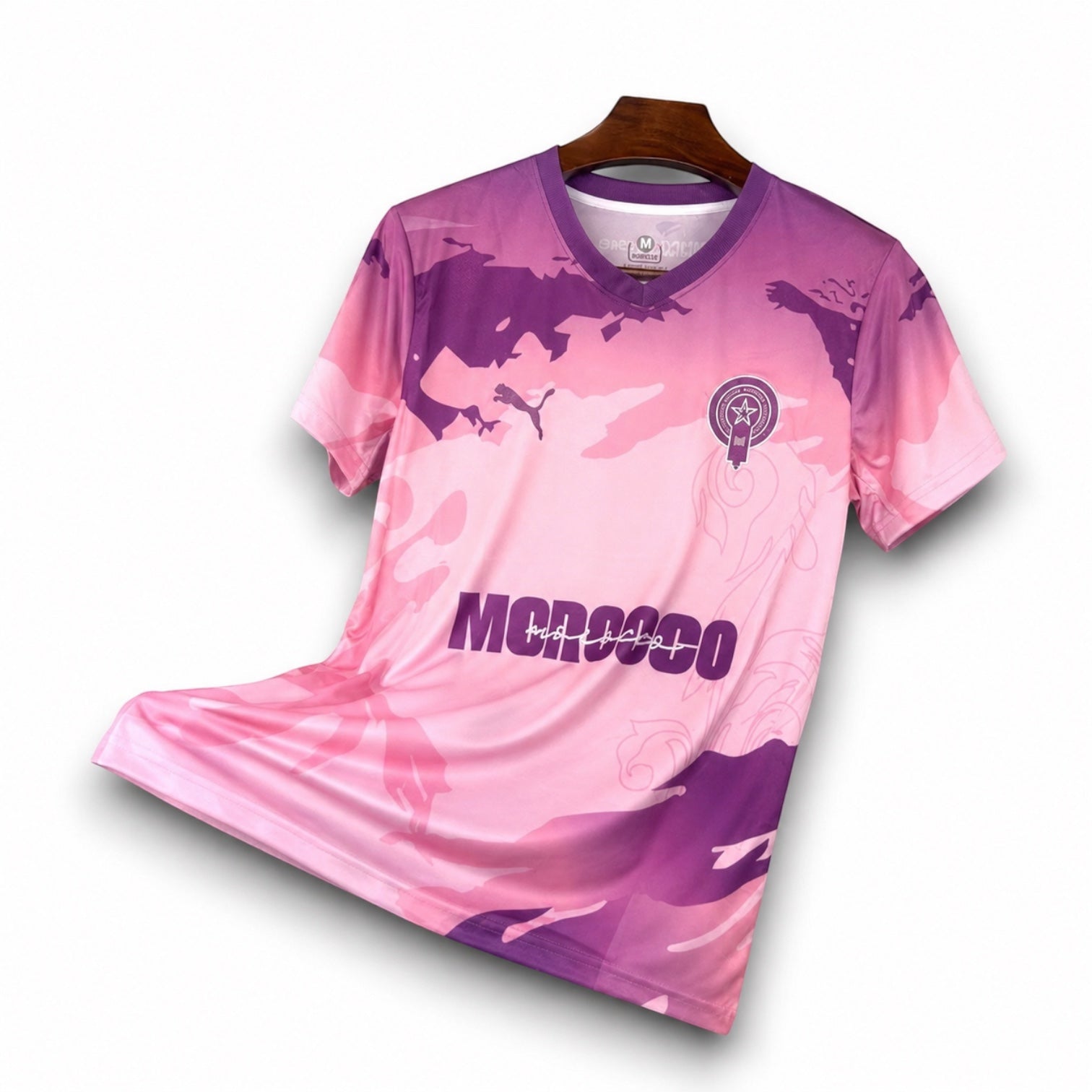 Leazofoot Morocco 2025 concept football jersey in pink and purple with a camouflage pattern and v-neck design.