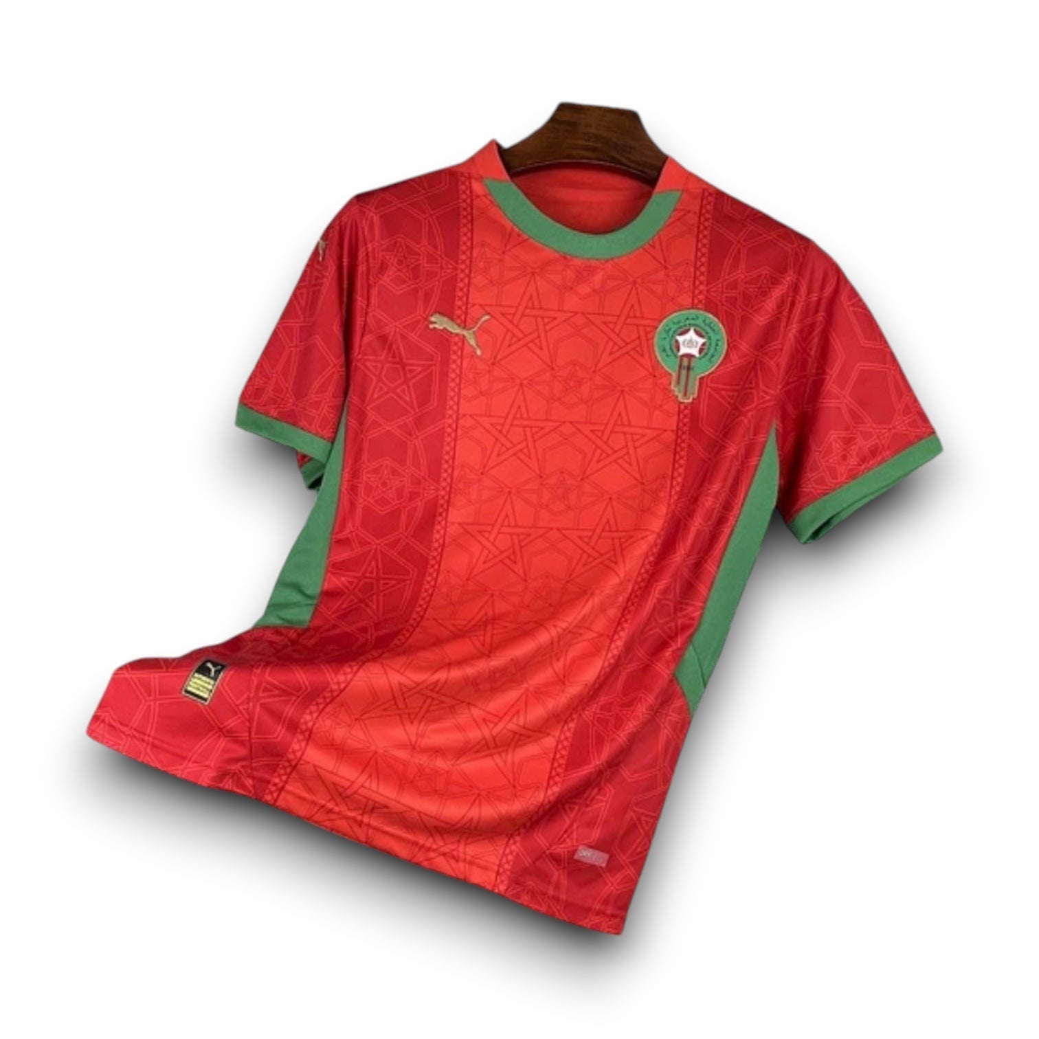 Leazofoot Morocco 2025 home football jersey in red with green trim and intricate geometric star pattern details.