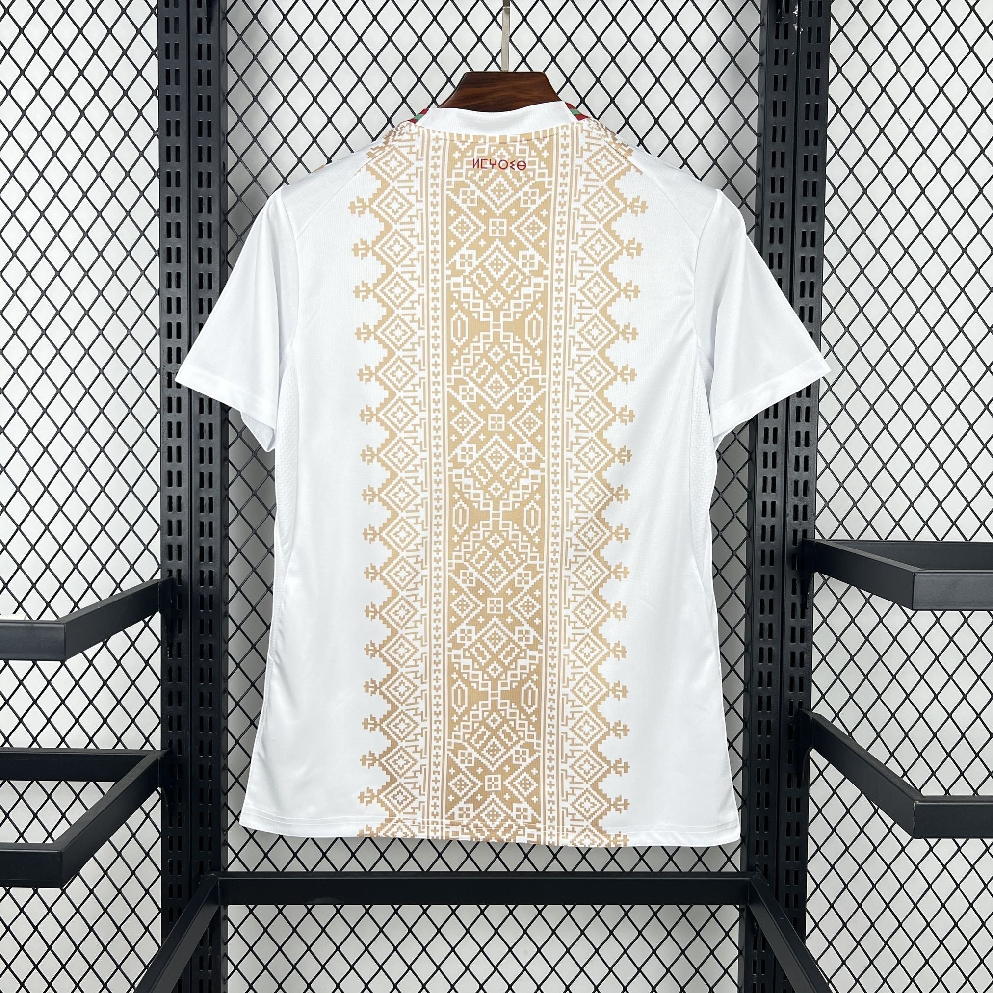 Leazofoot white football jersey with gold geometric pattern and red/green trim on collar, 2026 Morocco away kit.