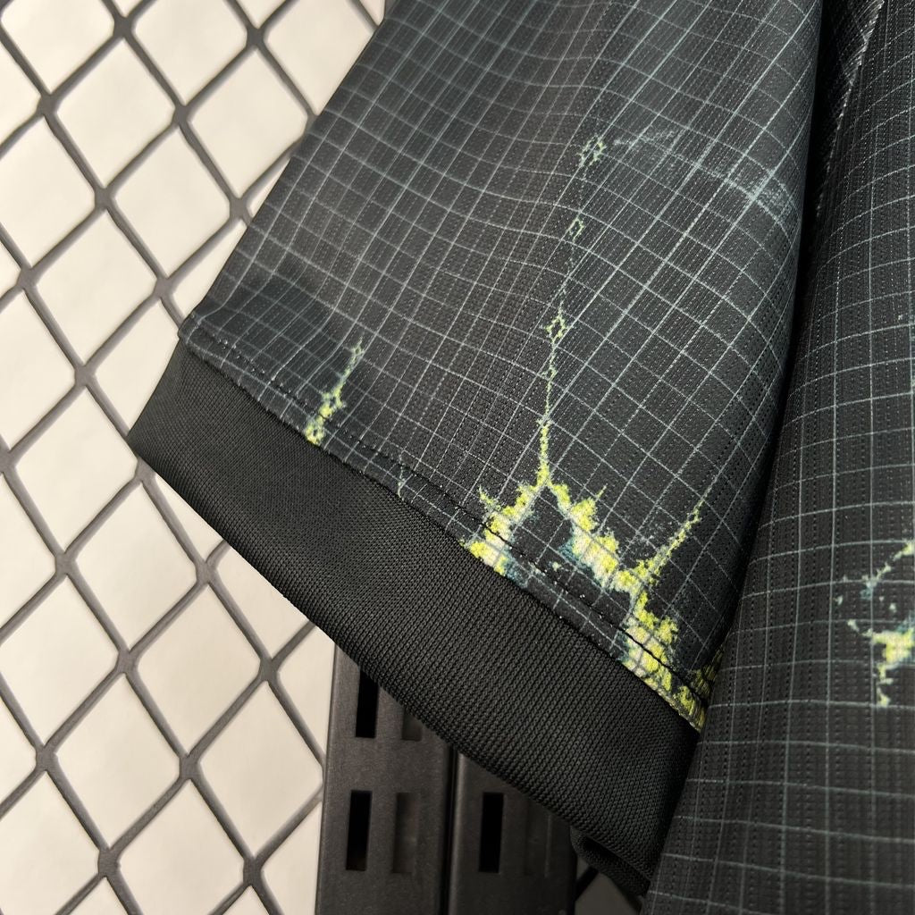 Leazofoot Netherlands 2026 goalkeeper jersey in black with a grid pattern and yellow lightning-style graphic details.