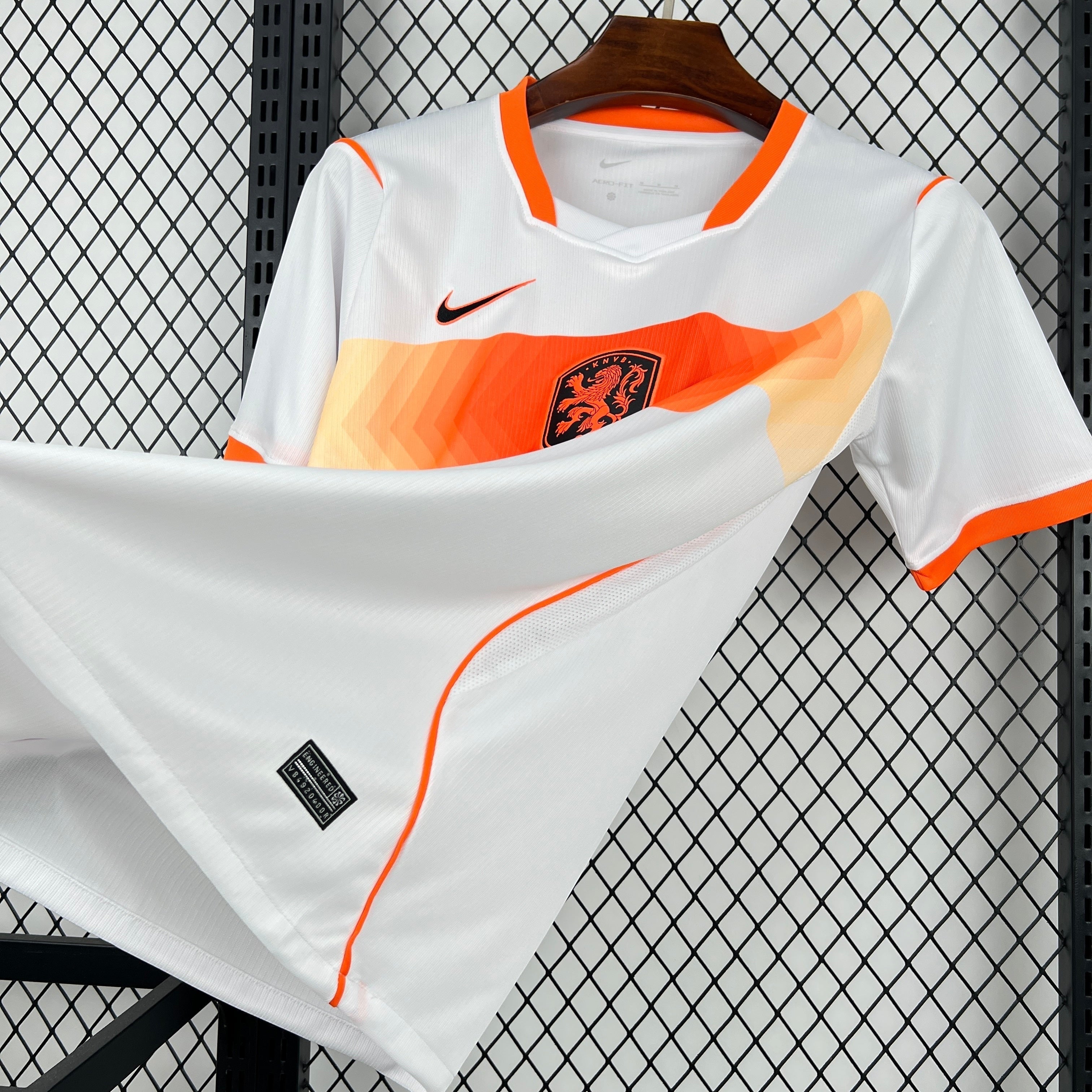 Leazofoot Netherlands 2026 away jersey, white with orange accents and gradient detail. Features Nike logo and team crest.
