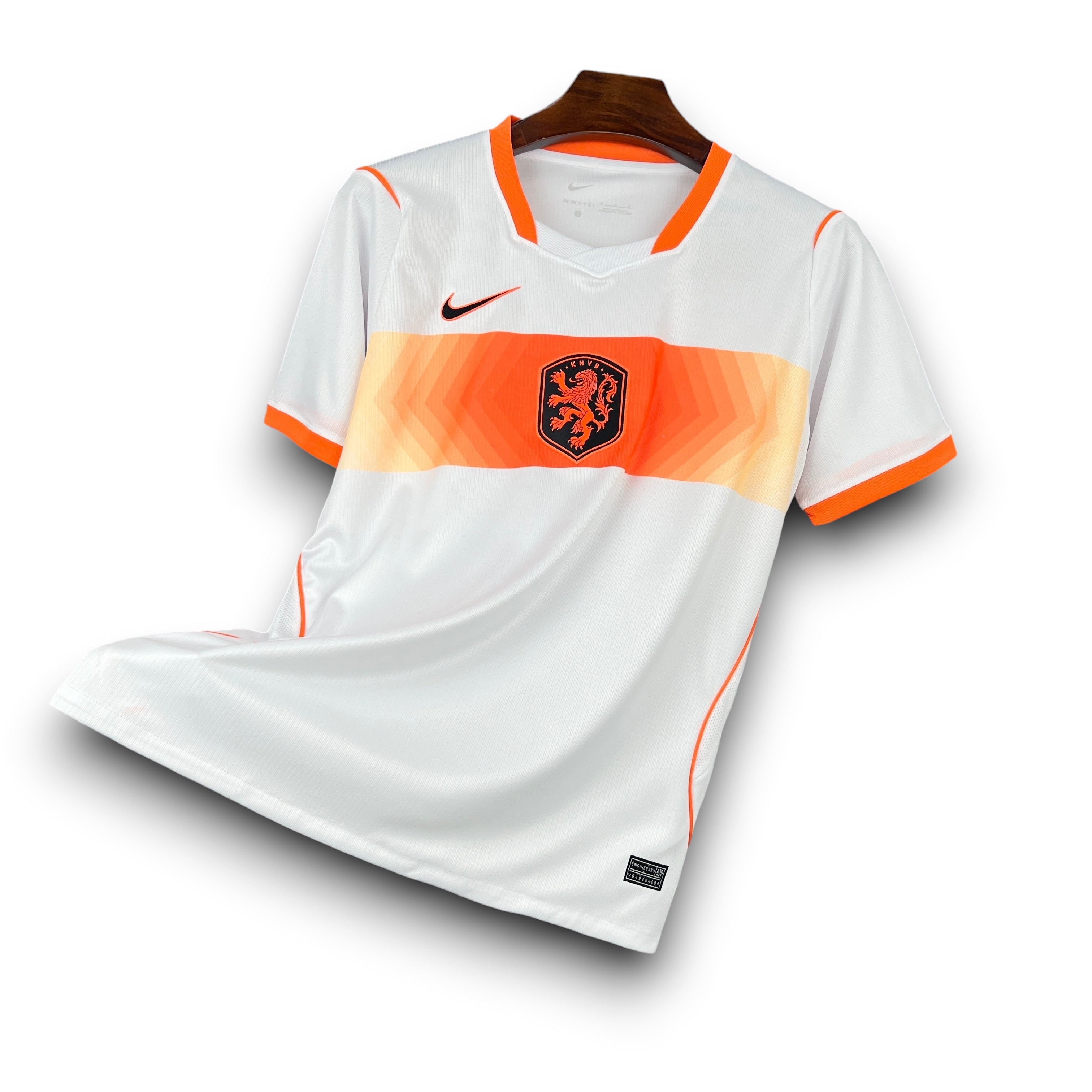 Leazofoot Netherlands 2026 away football jersey, white with orange trim and a gradient orange stripe across the chest featuring the team crest.