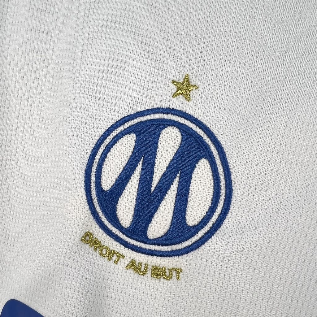 Leazofoot Olympique de Marseille 26/27 home jersey featuring an embroidered blue club crest and gold star detail.