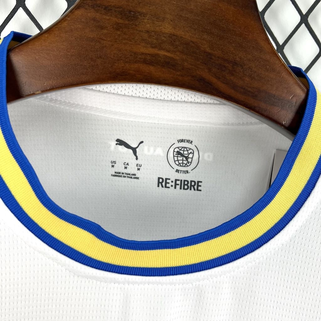 Leazofoot Olympique de Marseille 26/27 home jersey collar detail with blue and yellow trim and RE:FIBRE branding.
