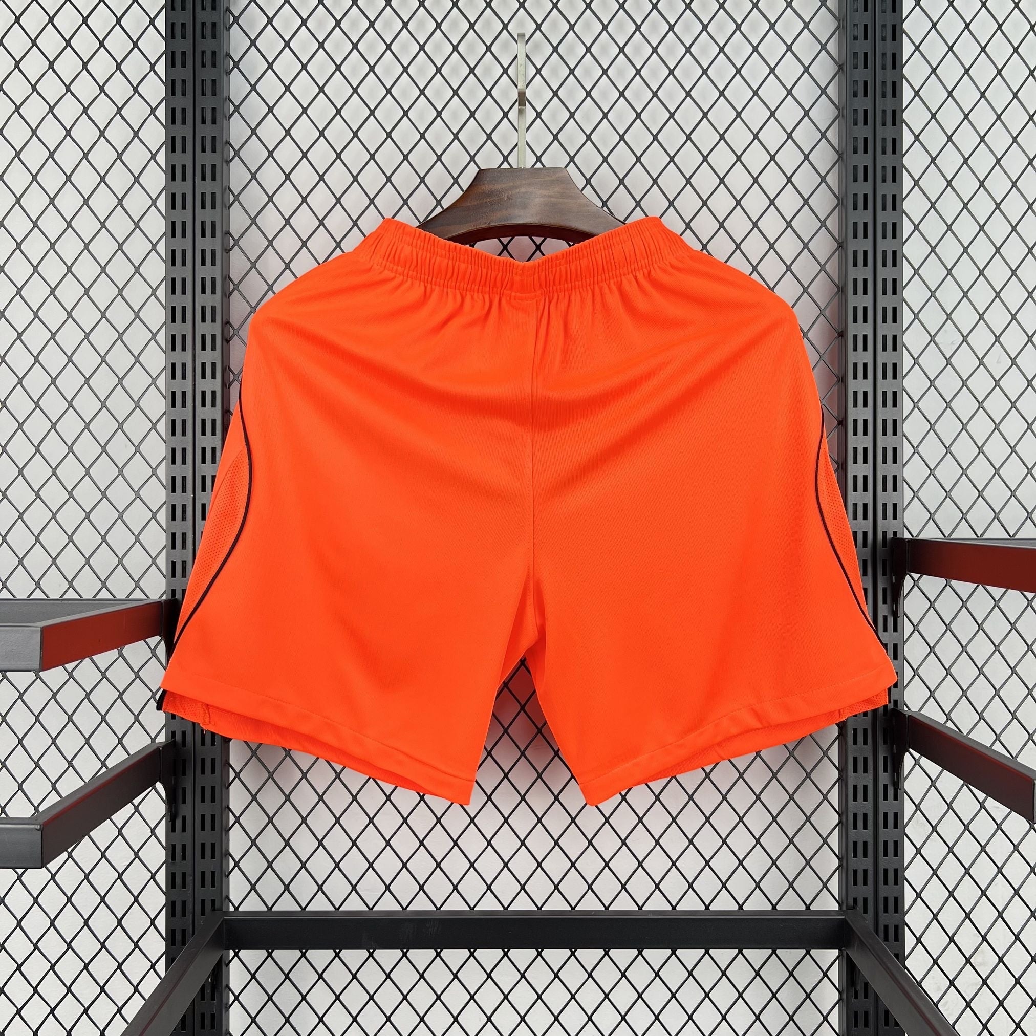 Leazofoot bright orange athletic shorts with black trim detail on the sides, elastic waistband.