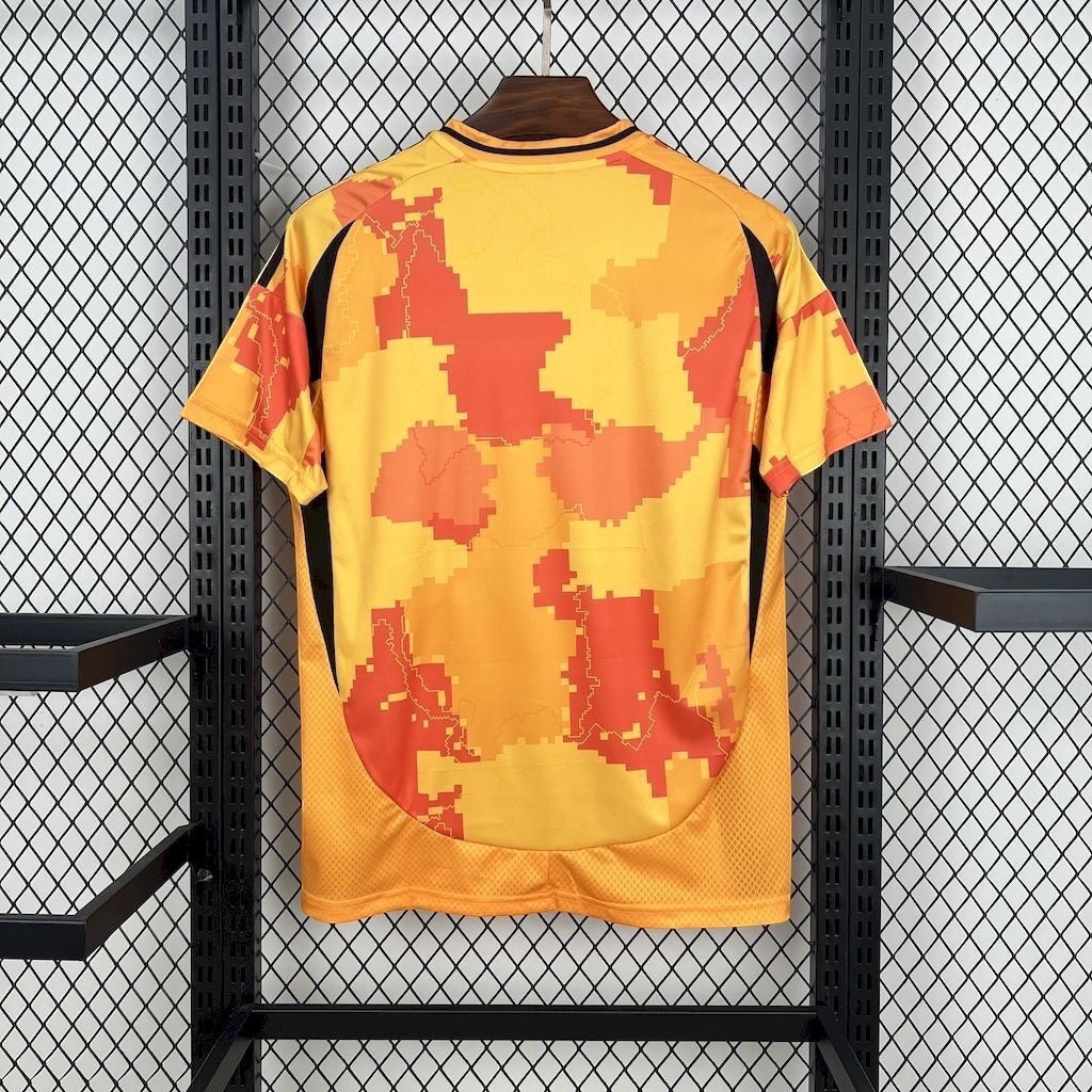 Leazofoot Paris FC 25/26 third football jersey in yellow and orange with a pixelated camouflage pattern.