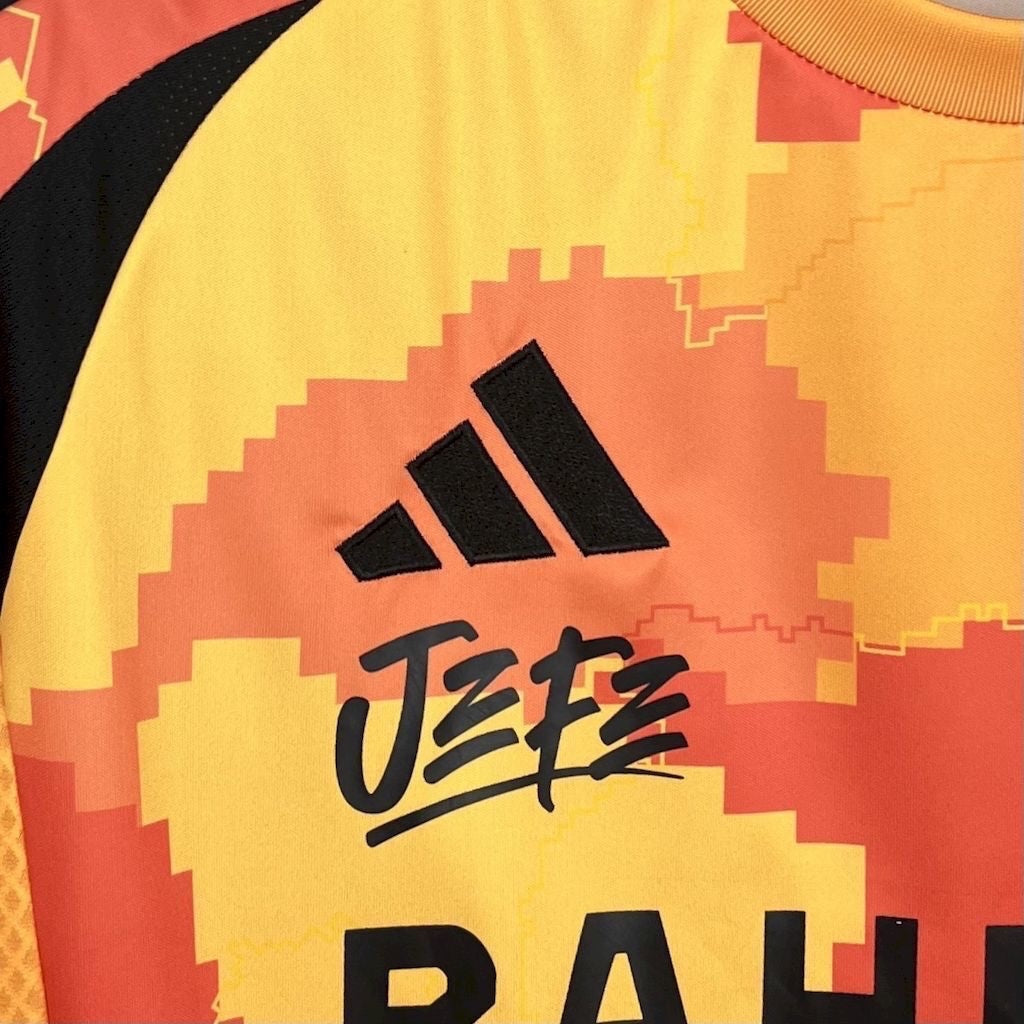 Leazofoot Paris FC 25/26 third jersey in yellow and orange with pixelated pattern and black Jefe branding.