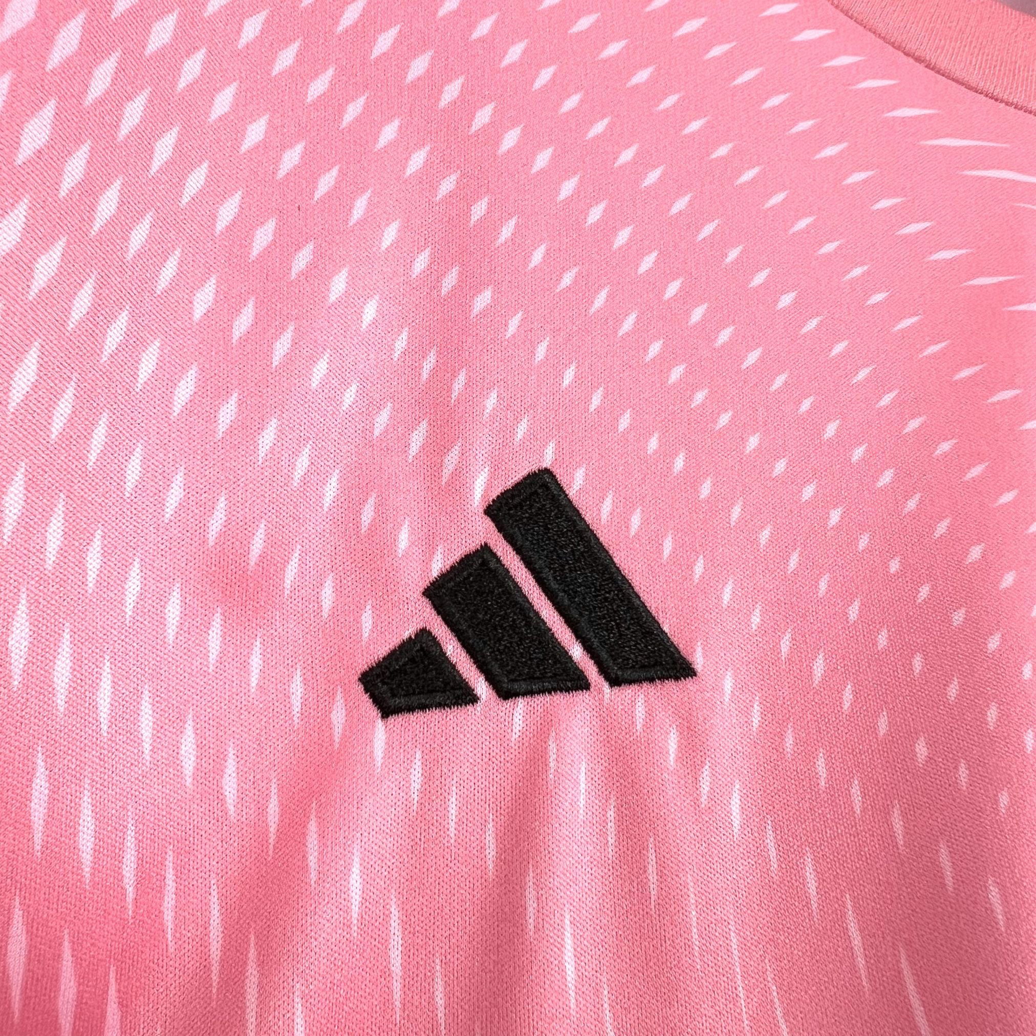 Leazofoot pink goalkeeper jersey with white diamond pattern and black Adidas logo.