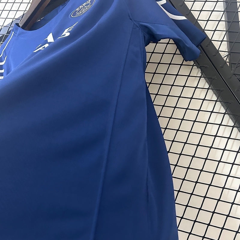 Leazofoot Paris Saint Germain 24/25 fourth football jersey in blue with team crest and white accents on a hanger.