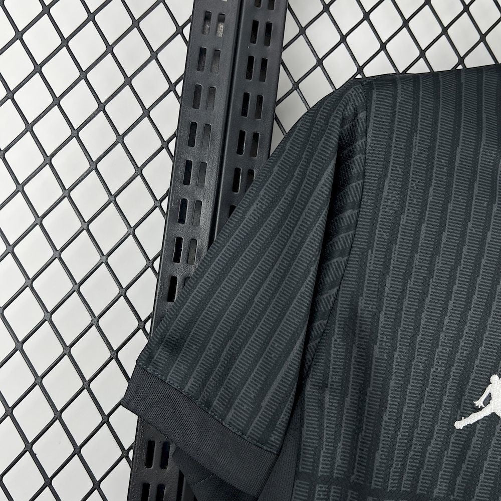 Leazofoot Paris Saint Germain 25/26 fourth jersey in black with subtle vertical textured stripes and white logo