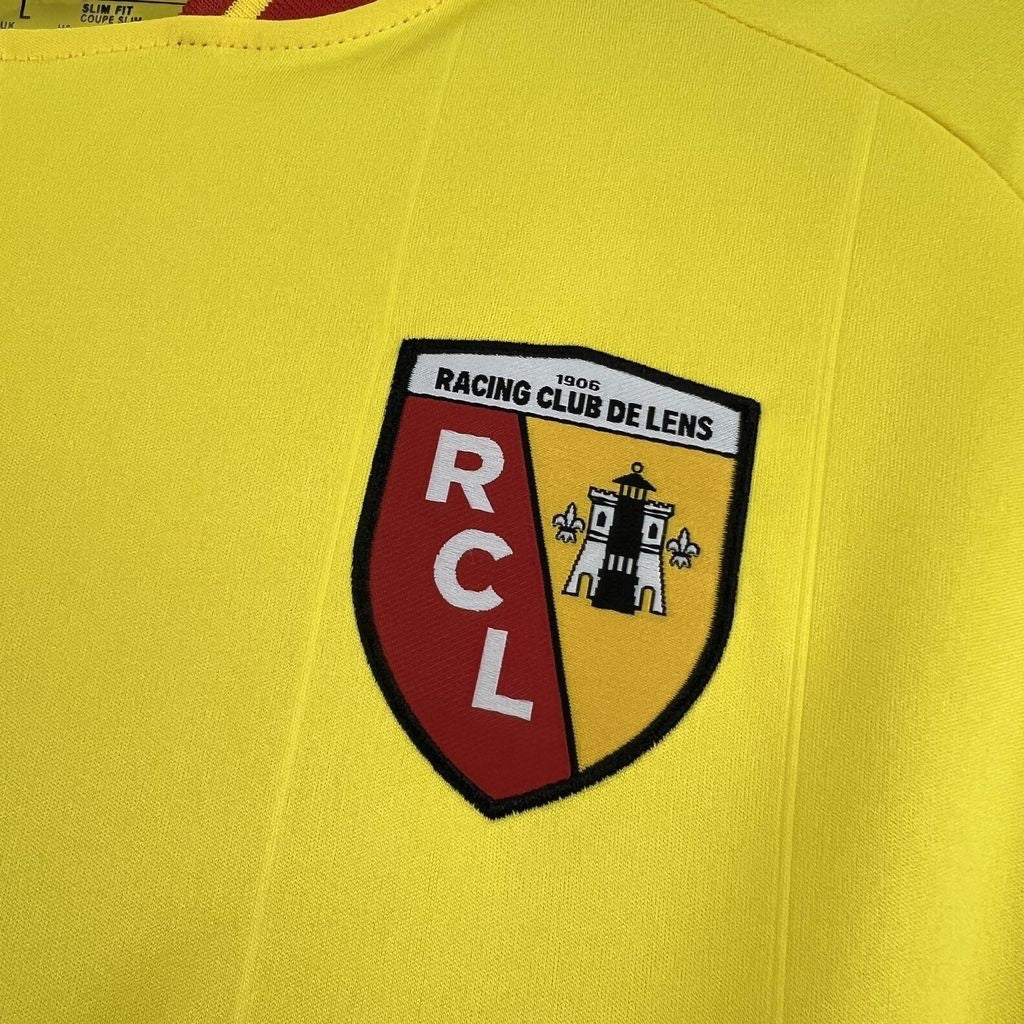 Leazofoot RC Lens 26/27 home jersey in yellow with embroidered club crest featuring red and black details.