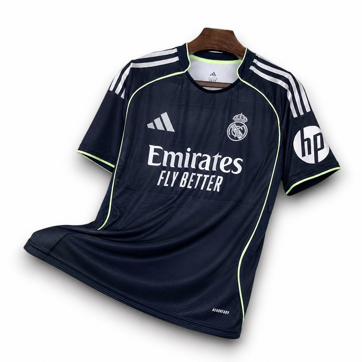 Leazofoot Real Madrid 2025-2026 away football jersey in dark navy with white accents and neon yellow trim.