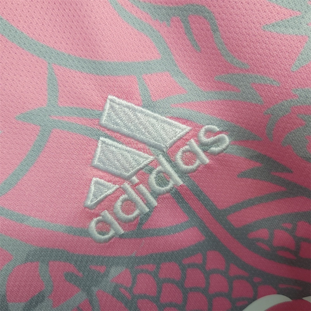 Leazofoot Real Madrid 23/24 special edition jersey featuring a pink fabric with grey dragon scale pattern and logo