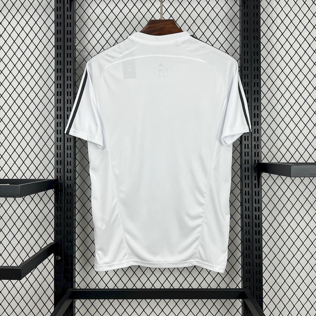 Back view of Leazofoot Real Madrid 25/26 white training jersey with black shoulder stripes on a hanger