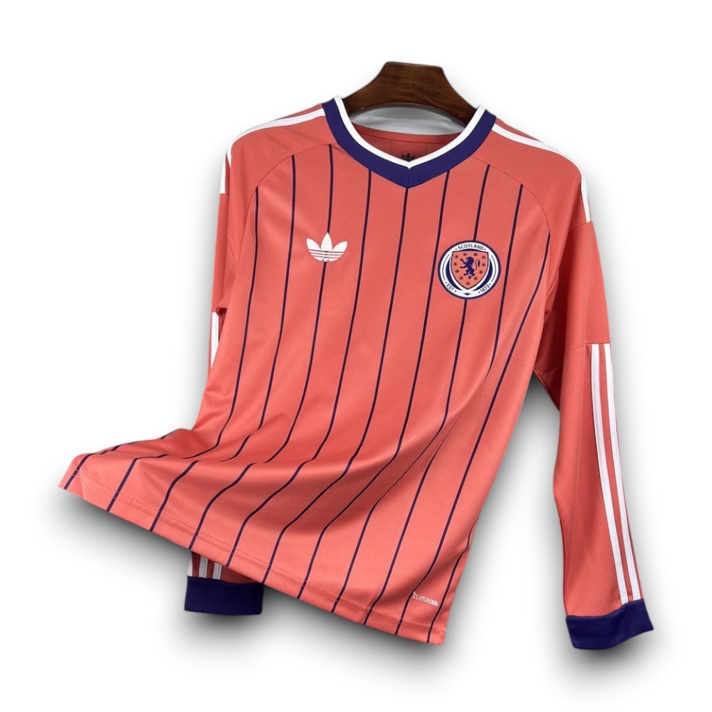Leazofoot Scotland 2026 long-sleeve away jersey in coral with navy pinstripes, white trim, and team crest.