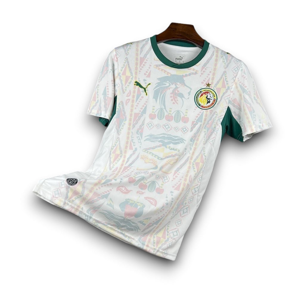Leazofoot Senegal 2026 home football jersey in white with green accents and traditional patterned graphic print.