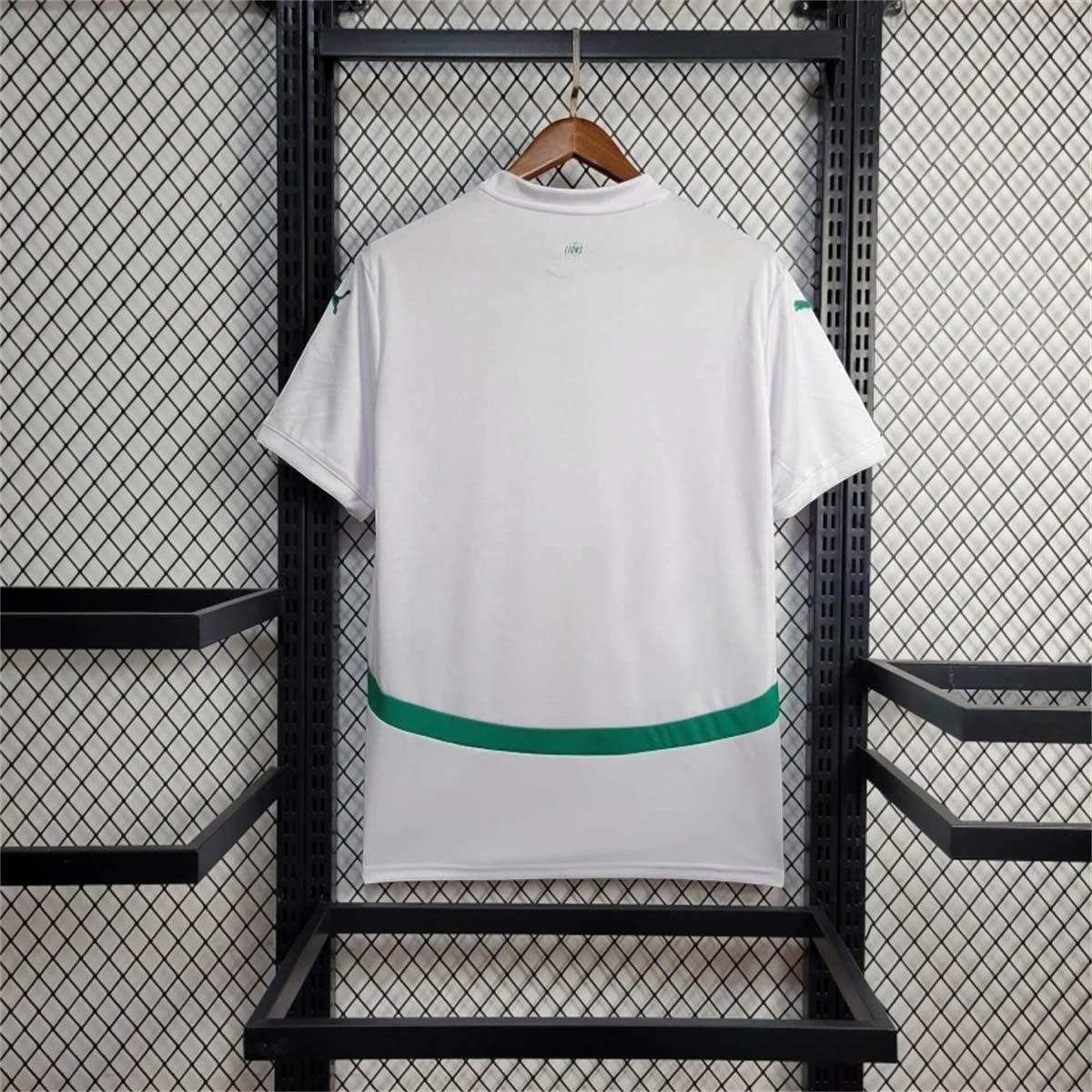 Leazofoot Senegal 24/25 home football jersey in white with green accent stripe on back, hanging on a display rack.