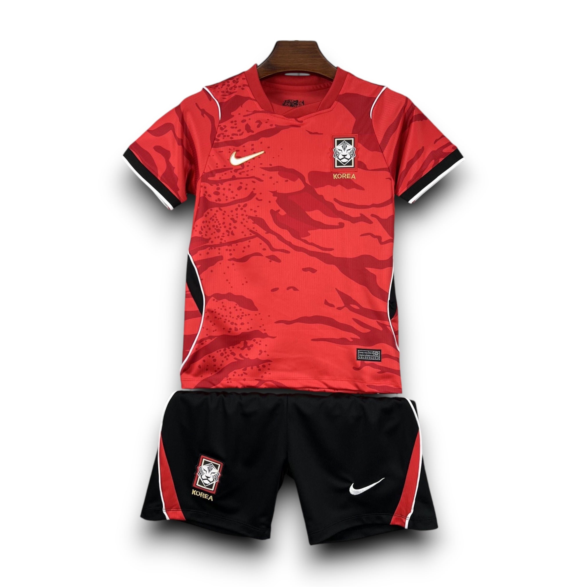Leazofoot South Korea kids' soccer uniform, red jersey with black and white trim, black shorts with red trim.