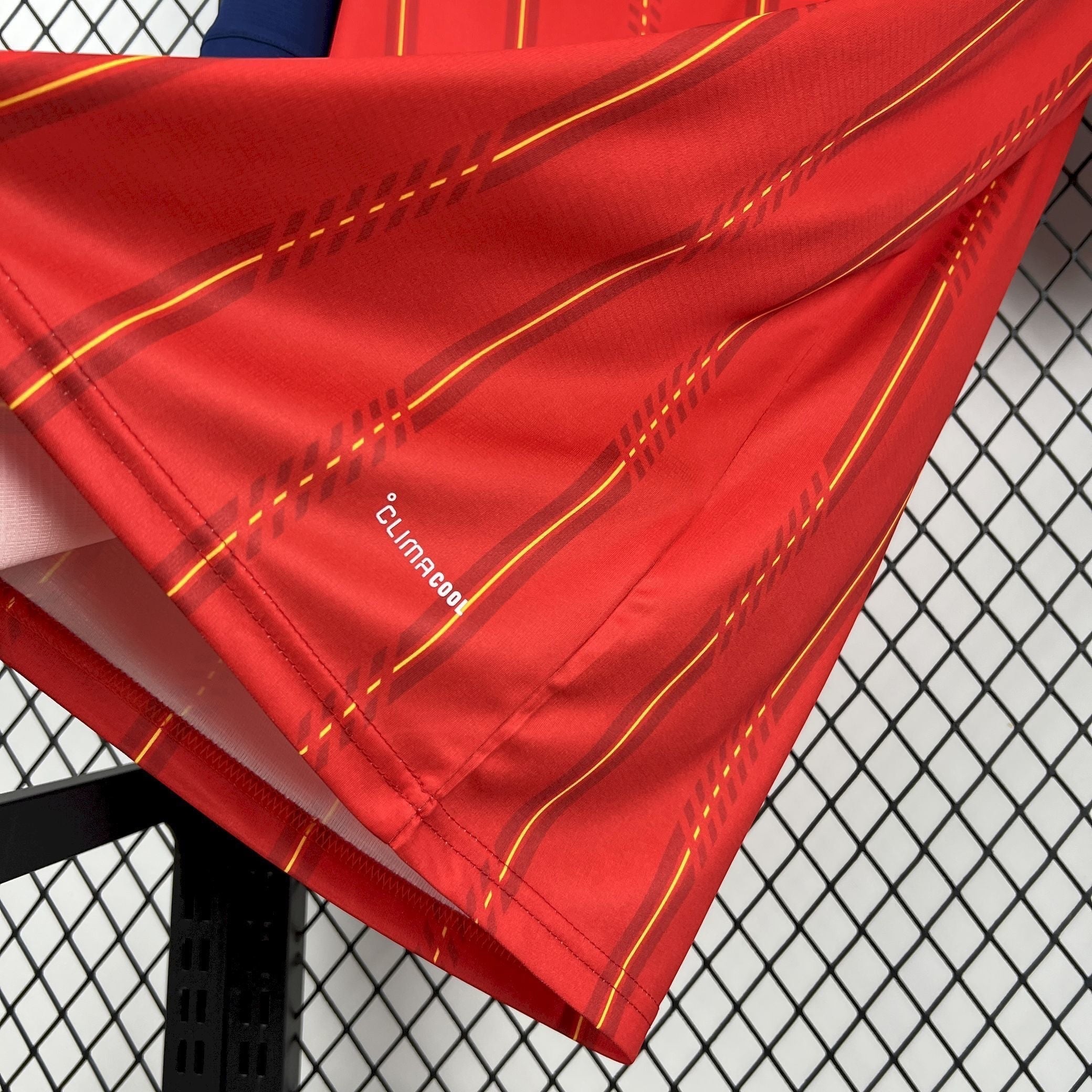 Leazofoot red and yellow striped Spain 2026 home football jersey with Climacool technology.