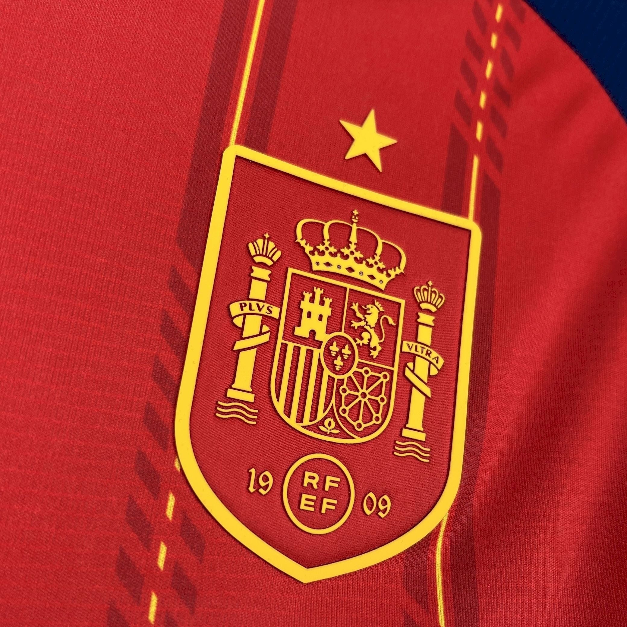 Leazofoot Spain 2026 home football jersey in red with yellow crest and star detail.