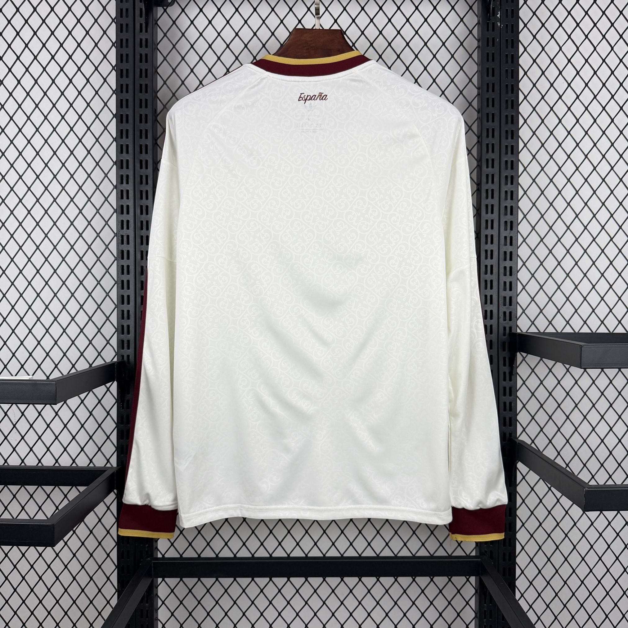 Leazofoot Spain long sleeve away jersey 2026, white with subtle pattern, maroon and gold trim.