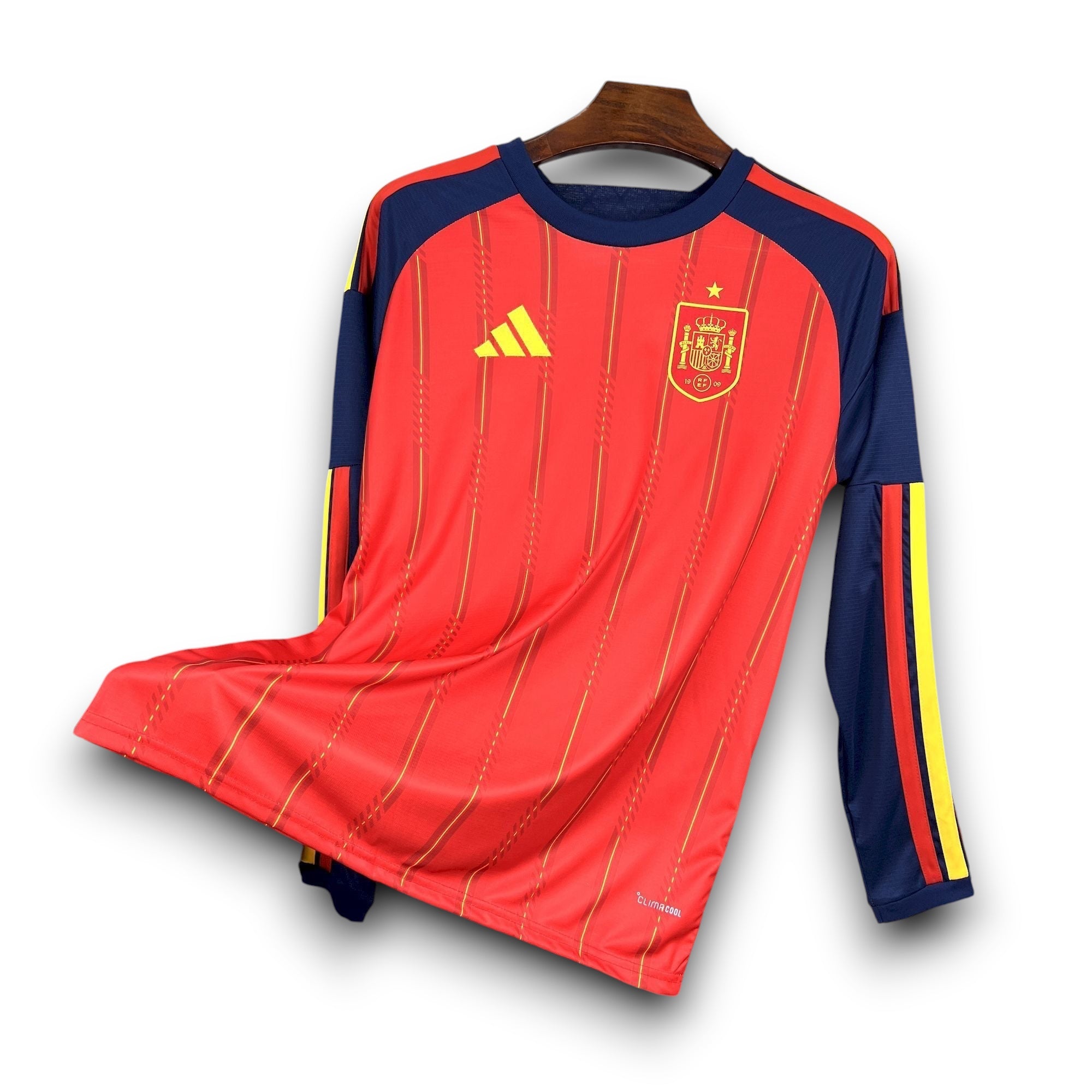 Leazofoot Spain long sleeve home soccer jersey 2026. Red with yellow pinstripes and navy blue sleeves.