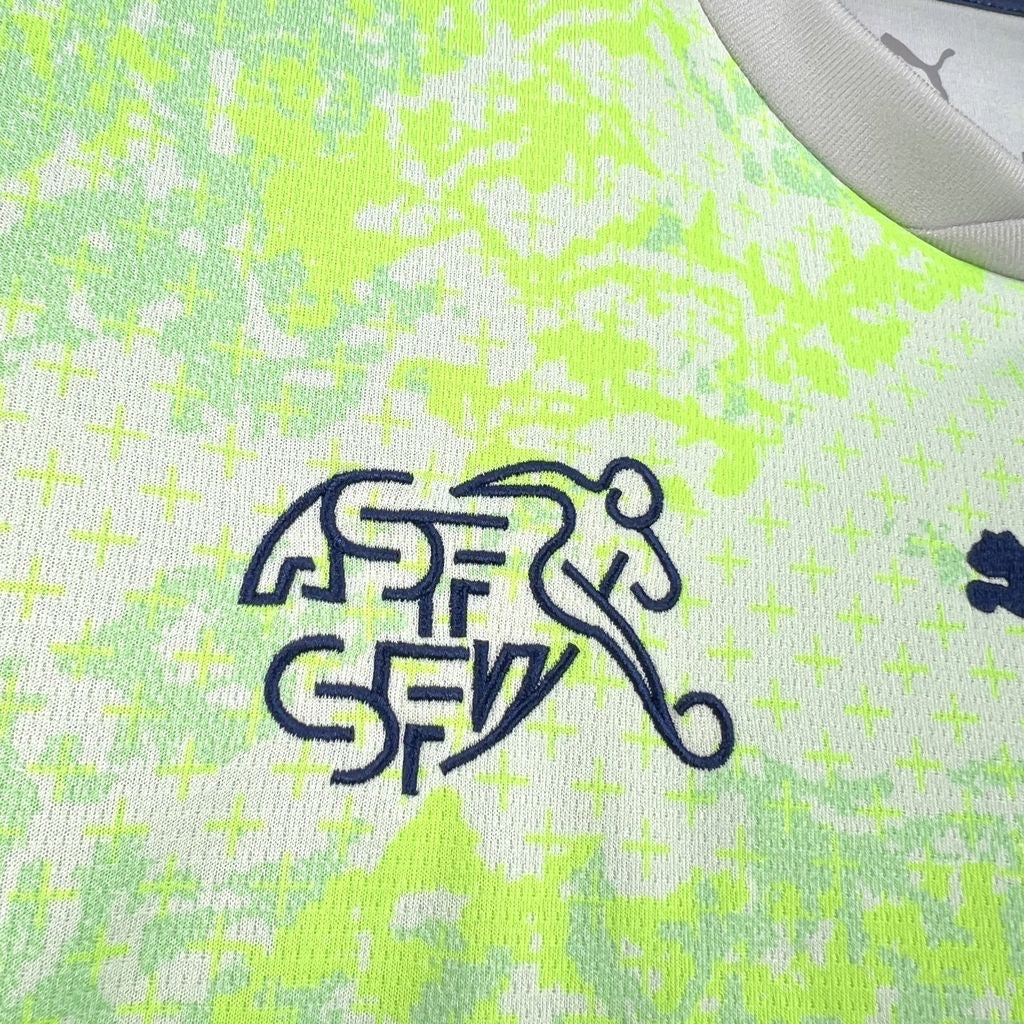 Leazofoot Switzerland 2026 away jersey featuring a neon green and white abstract pattern with navy blue team crest.