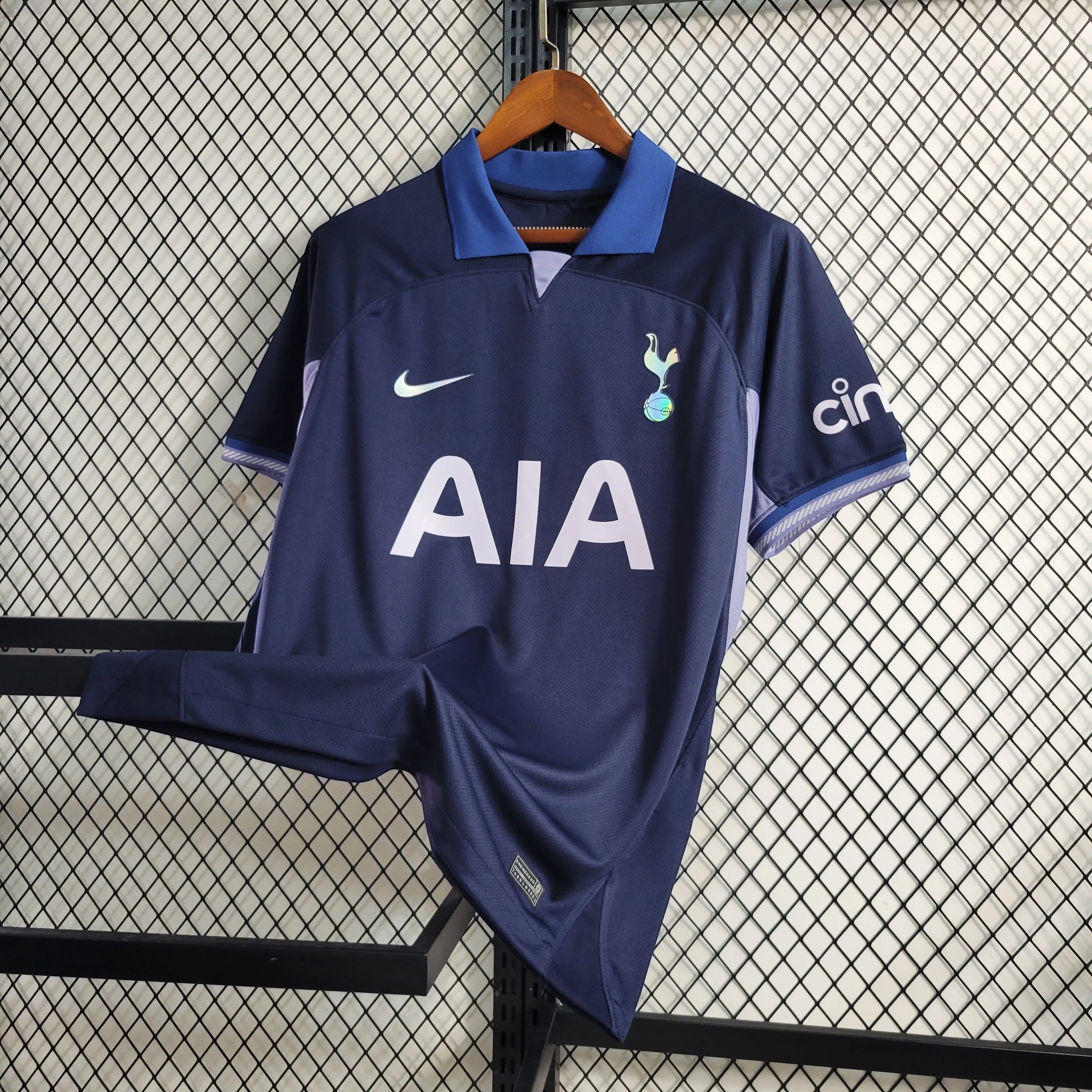 Leazofoot Tottenham Hotspur 23/24 men's navy blue football jersey with AIA sponsor and Nike logo.