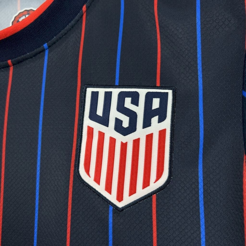 Leazofoot USA 2025 away soccer jersey in navy blue with red and blue vertical pinstripes and embroidered USA crest.