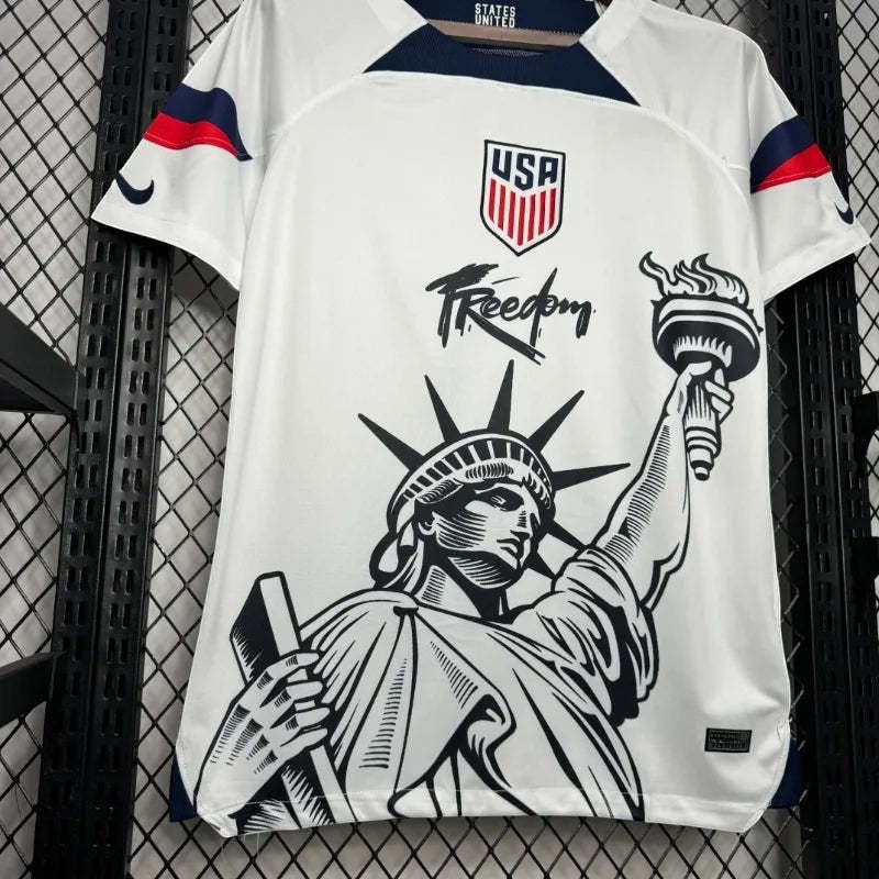 Leazofoot USA 2025 concept soccer jersey in white with Statue of Liberty graphic and red, white, and blue accents.