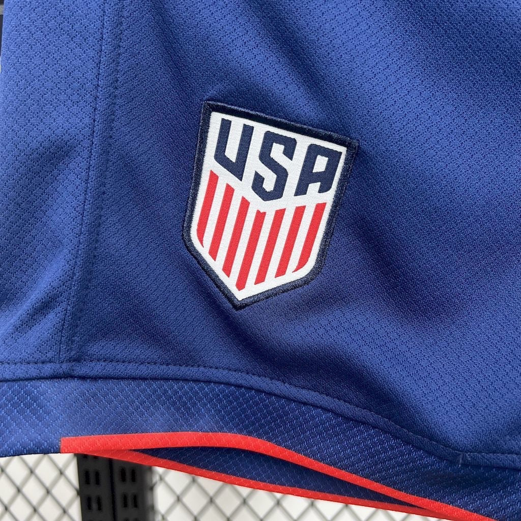 Leazofoot 2025 USA kids away soccer kit featuring a blue textured jersey with the official USA crest and red trim.