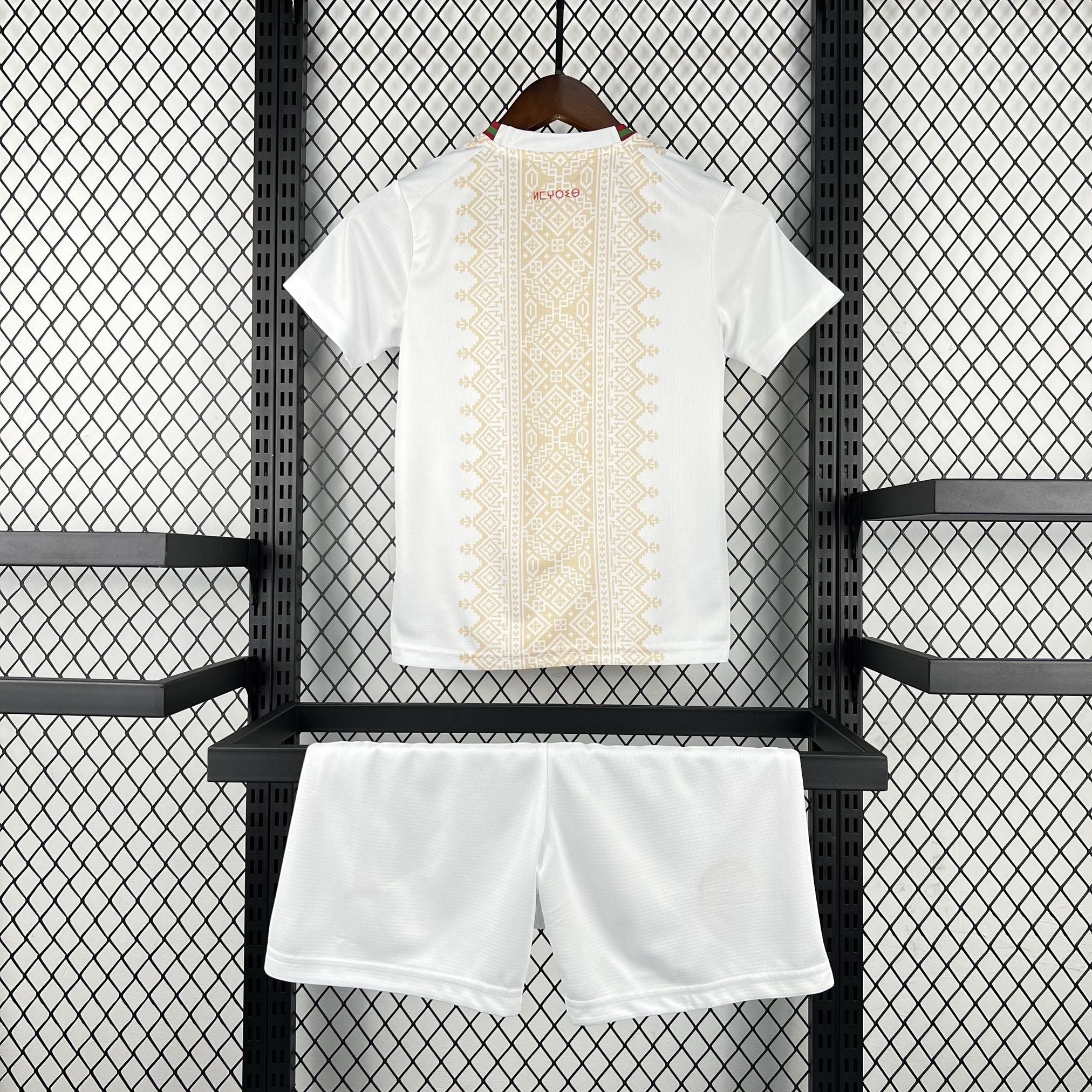 Leazofoot white children's soccer kit with gold geometric pattern on the back of the shirt.