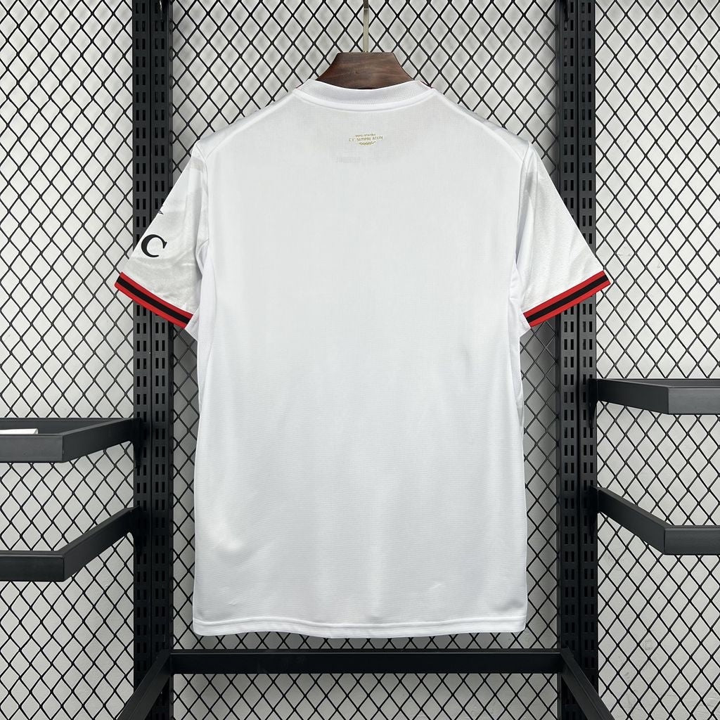 Leazofoot AC Milan 26/27 away jersey in white with red and black sleeve trim, back view on a display rack.