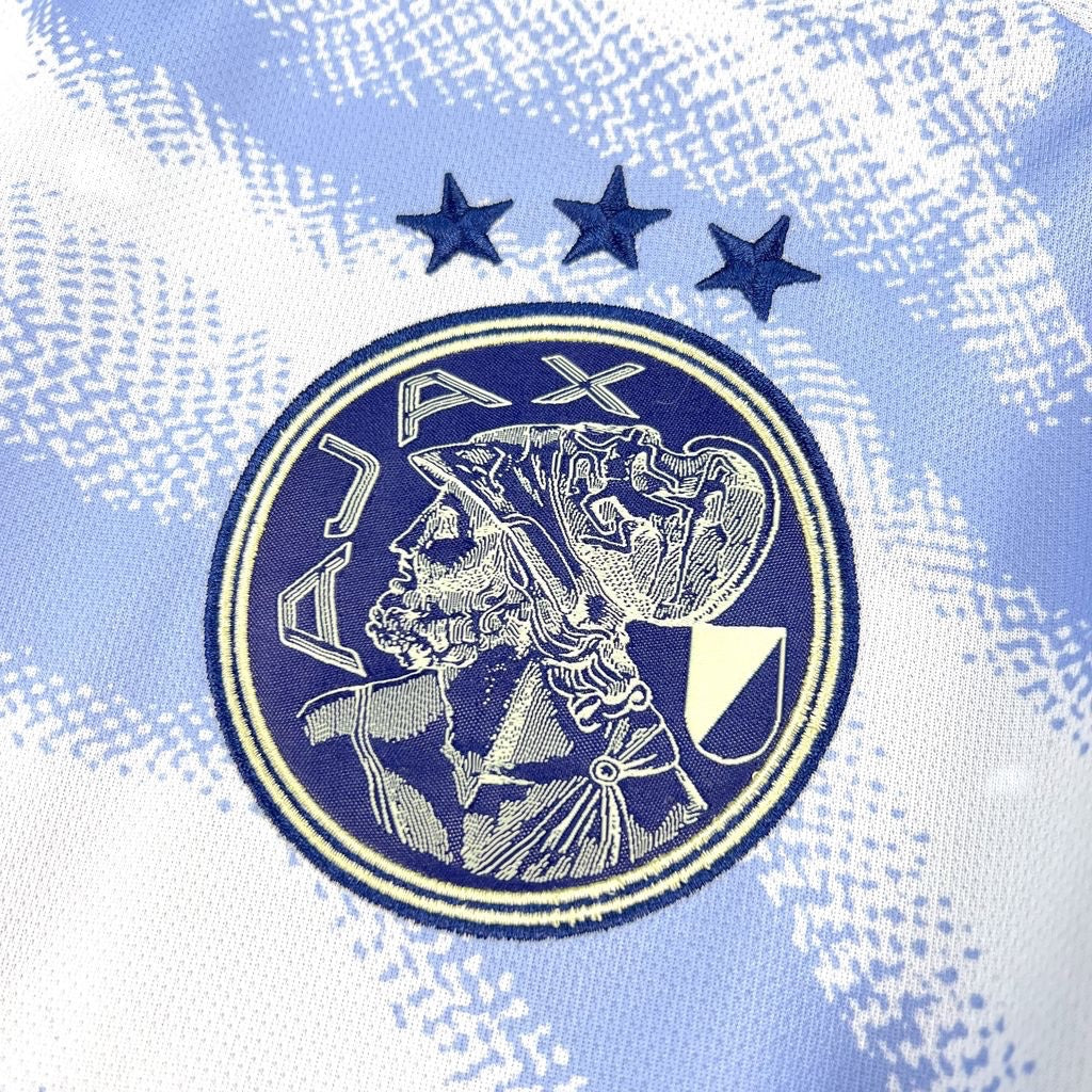Leazofoot AJAX third football jersey 26/27, light blue with white pattern and embroidered crest with three stars.