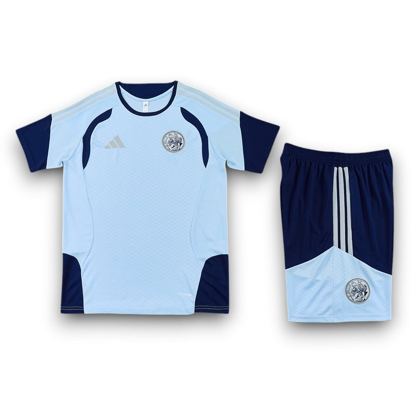 Leazofoot Ajax 26/27 training kit featuring a light blue and navy jersey with matching shorts and team crest.