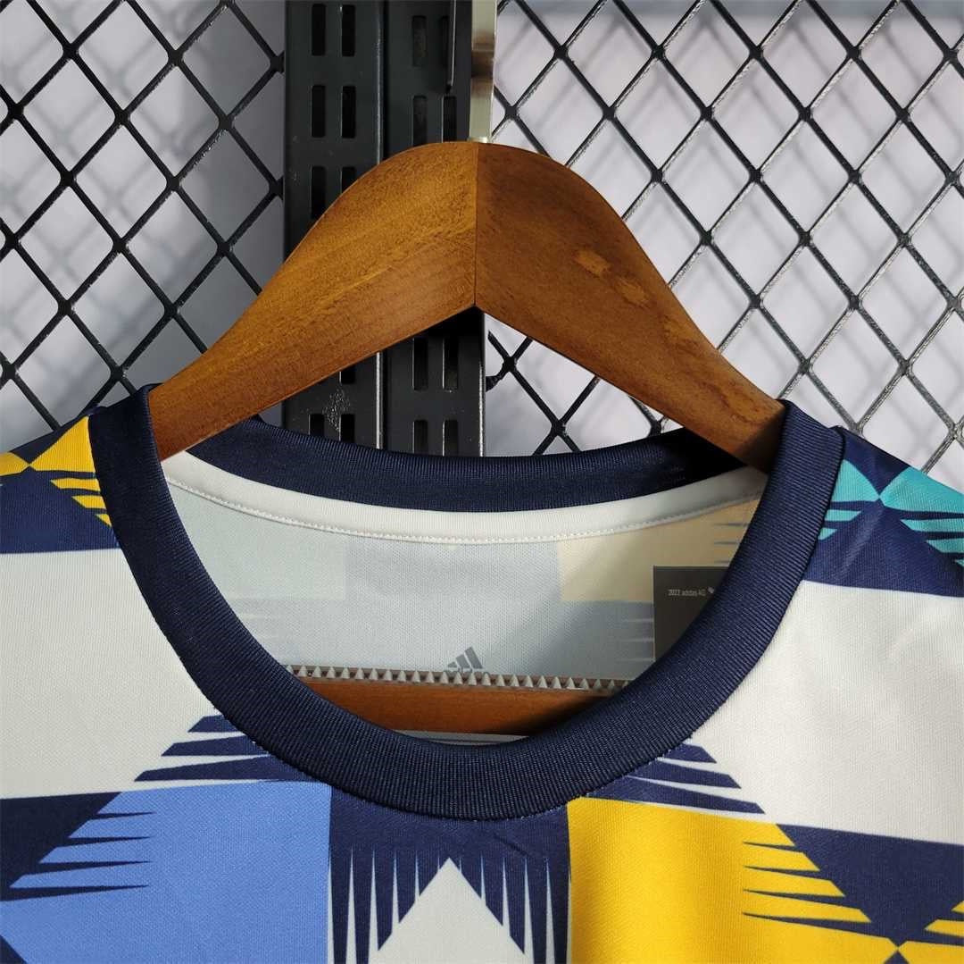 Leazofoot Algeria 2022 training jersey featuring a geometric pattern in navy, white, yellow, and light blue.