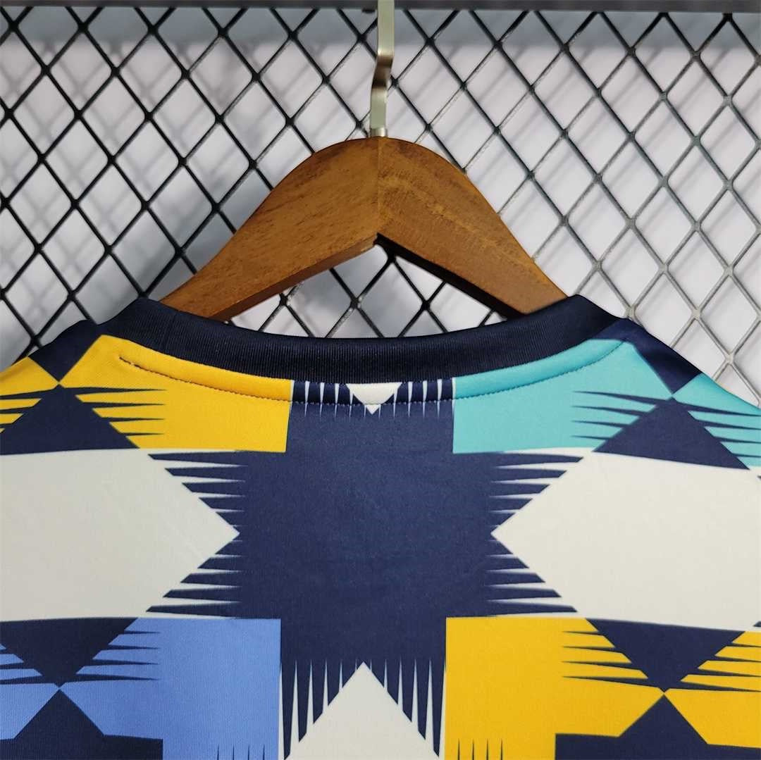 Leazofoot Algeria 2022 training jersey featuring a geometric star pattern in navy, yellow, white, and light blue.